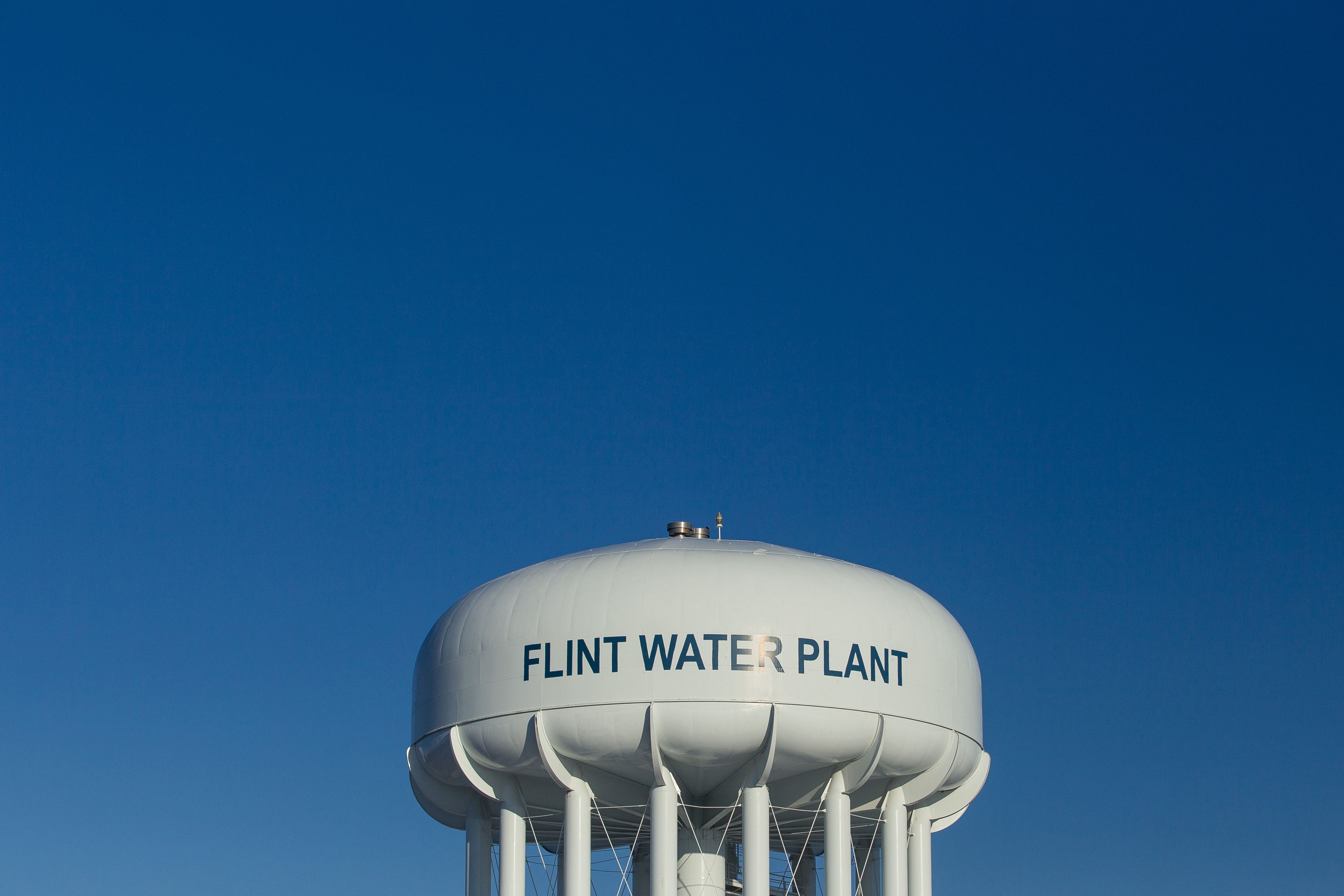 The water tower at the Flint Water Plant in Flint, Michigan,  looms large over the city March 4, 2016 (Geoff Robins — AFP/Getty Images)