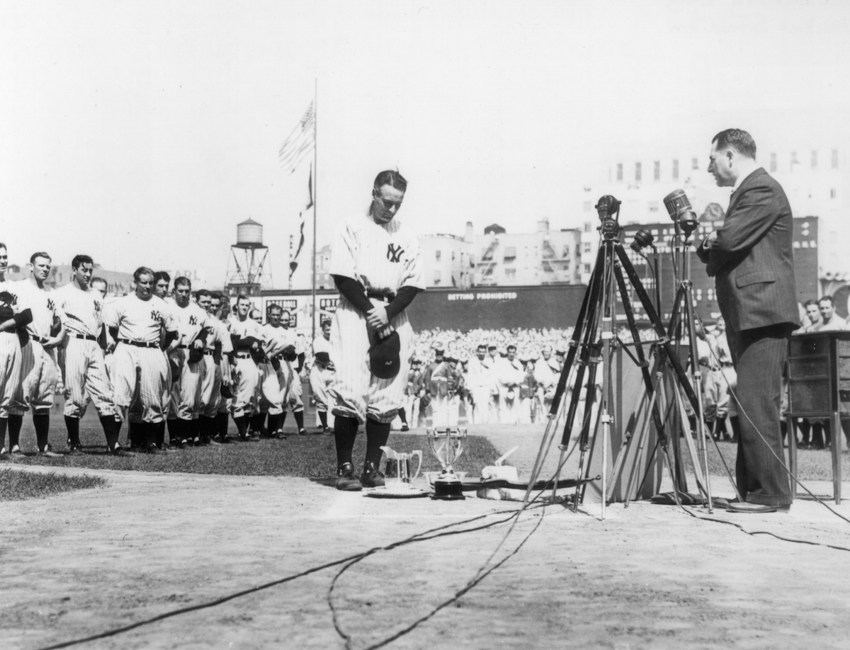 Lou Gehrig, first baseman for the New York Yankees, is shown at the microphone during Lou Gehrig Appreciation Day, a farewell to the slugger, at Yankee Stadium on July 4, 1939. (Mark Rucker—Transcendental Graphics /Getty Images)