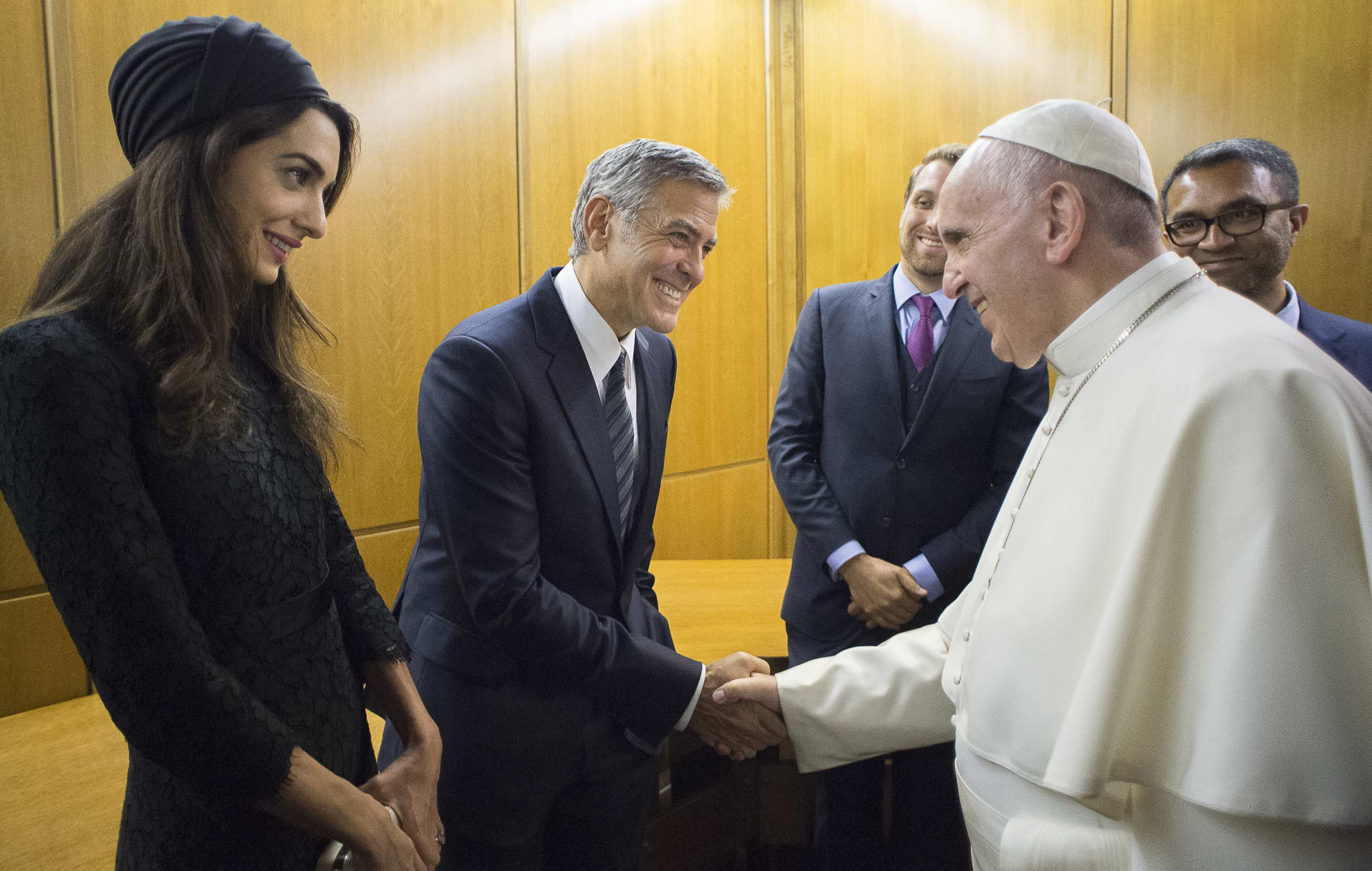 Pope Francis meets George Clooney and his wife Amal at the Vatican on May 29, 2016.