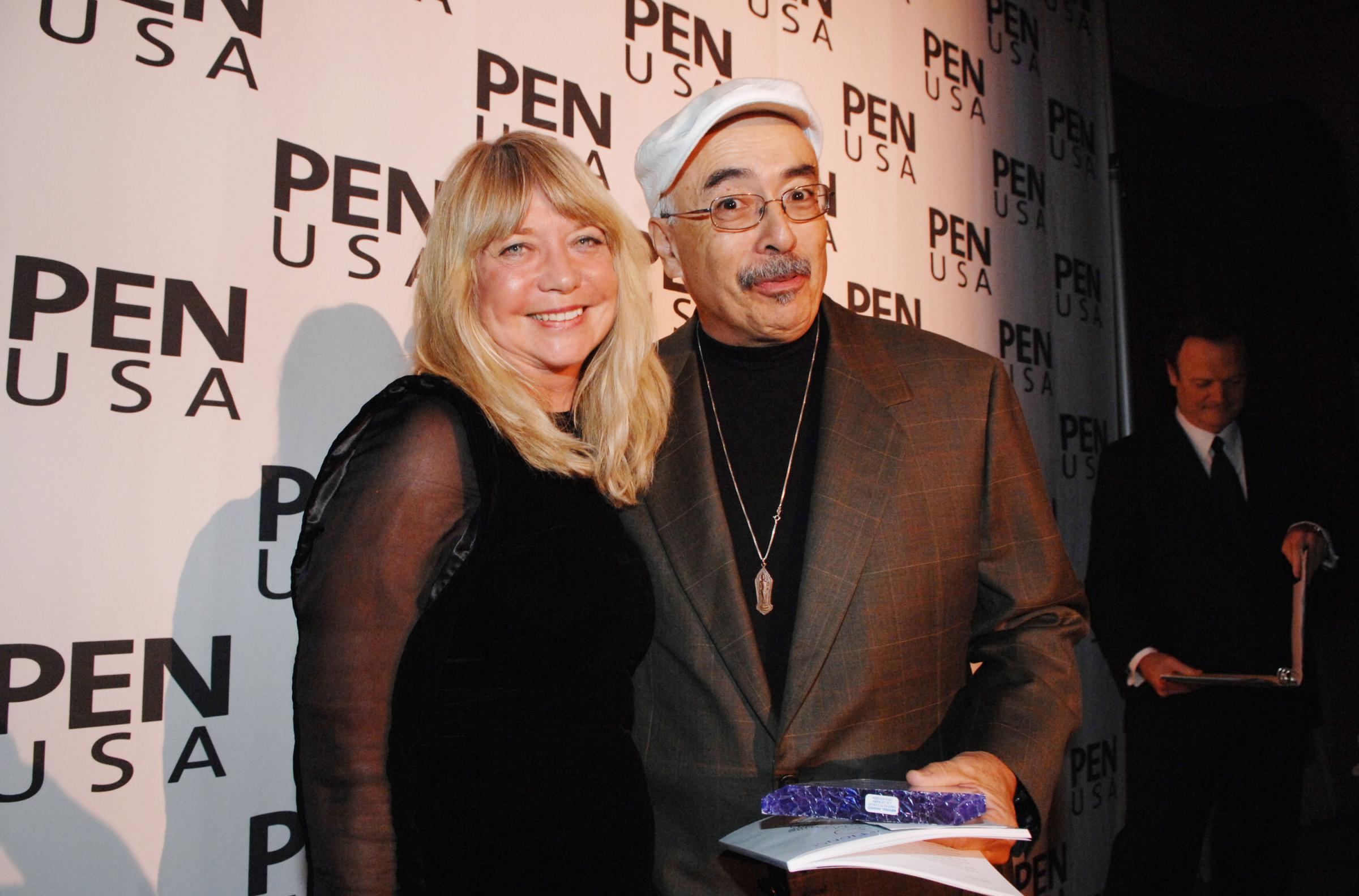Carol Muske-Dukes (L) presents the Poetry Award to Juan Felipe Herrera (R) at the 18th Annual PEN USA Literary Festival in Los Angeles on Dec. 3, 2008.