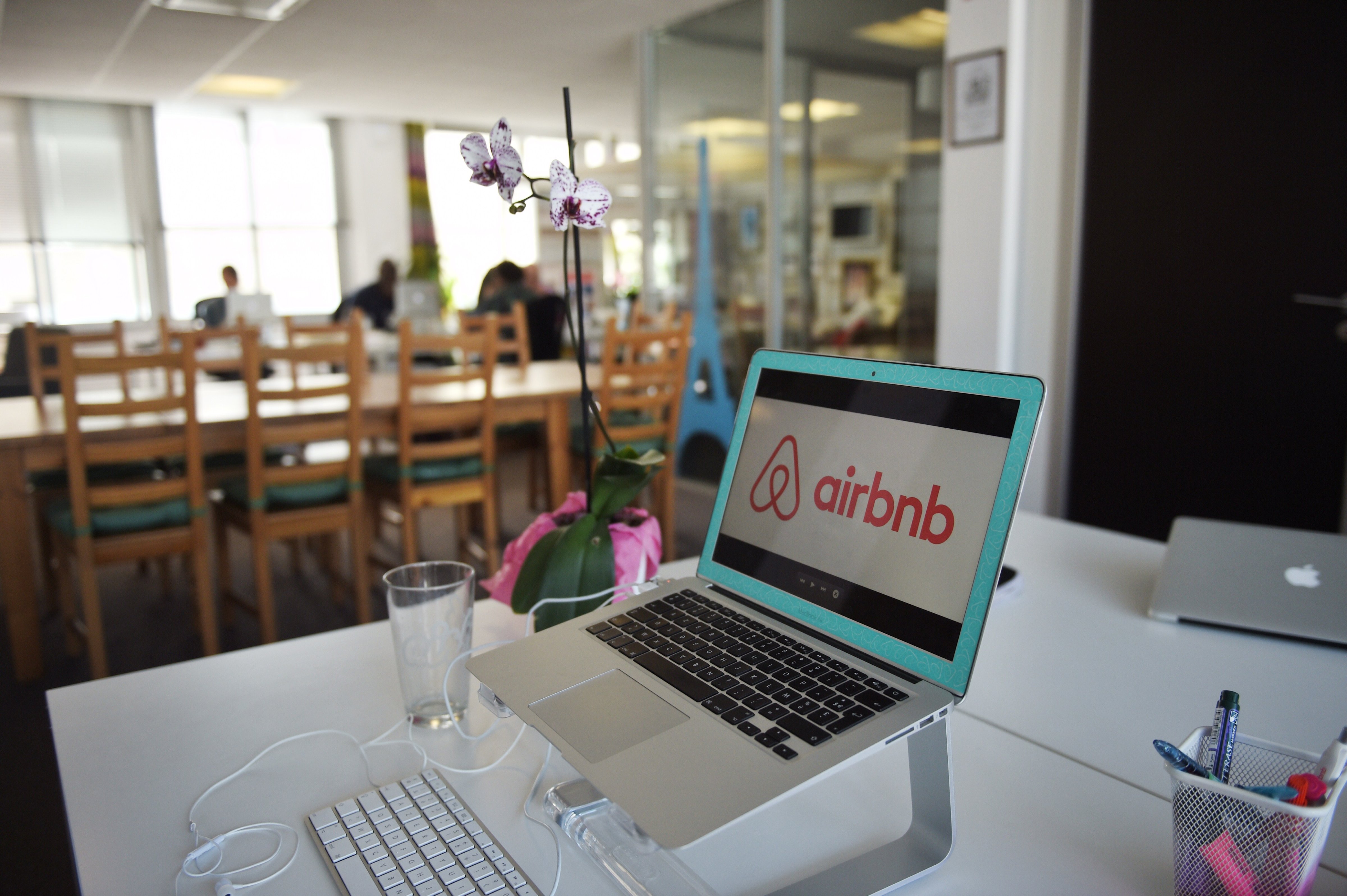 Airbnb logo displayed on a computer screen in the Airbnb offices in Paris on April 21, 2015 (Martin Bureau—AFP/Getty Images)