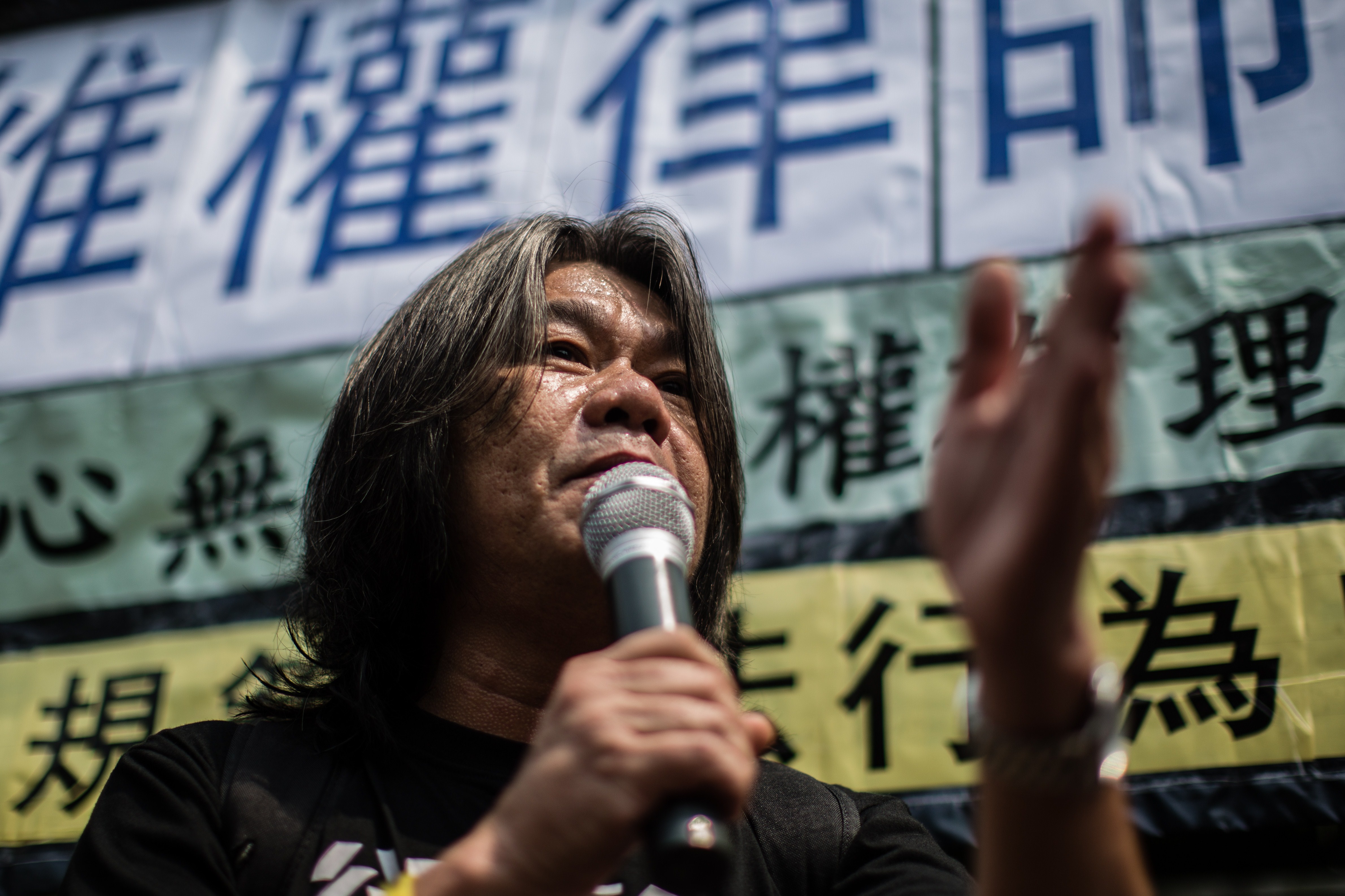 Hong Kong legislator Leung Kwok-hung, known as Long Hair, of the League of Social Democrats speaks during a protest in Hong Kong on July 12, 2015 (Anthony Wallace—AFP/Getty Images)
