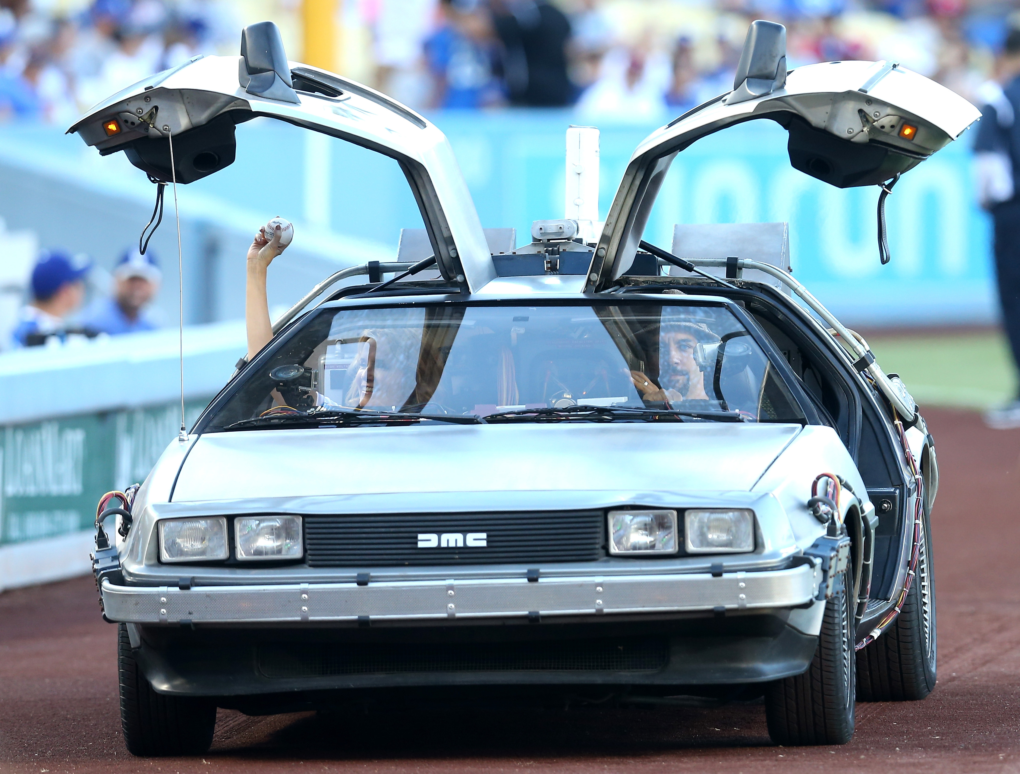 Actress Lea Thompson arrives in a DeLorean to throw out the first pitch before the game between the Cincinnati Reds and the Los Angeles Dodgers at Dodger Stadium on August 15, 2015 in Los Angeles, California, ahead of the after game showing of Back to Future on the stadium video boards. (Stephen Dunn&mdash;Getty Images)