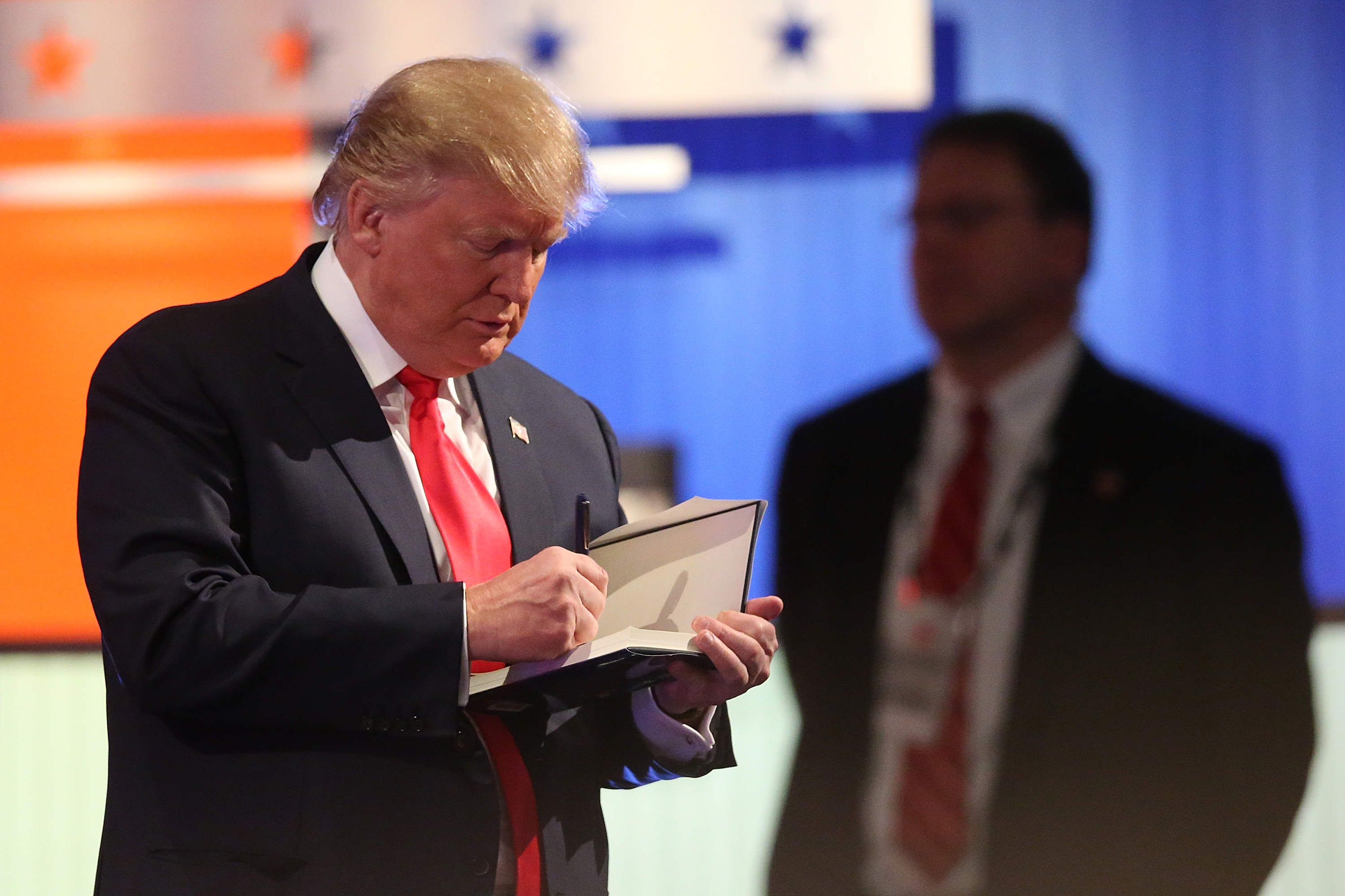 Donald Trump writing in a book in North Charleston, South Carolina on January 14, 2016. (Scott Olson&mdash;Getty Images)