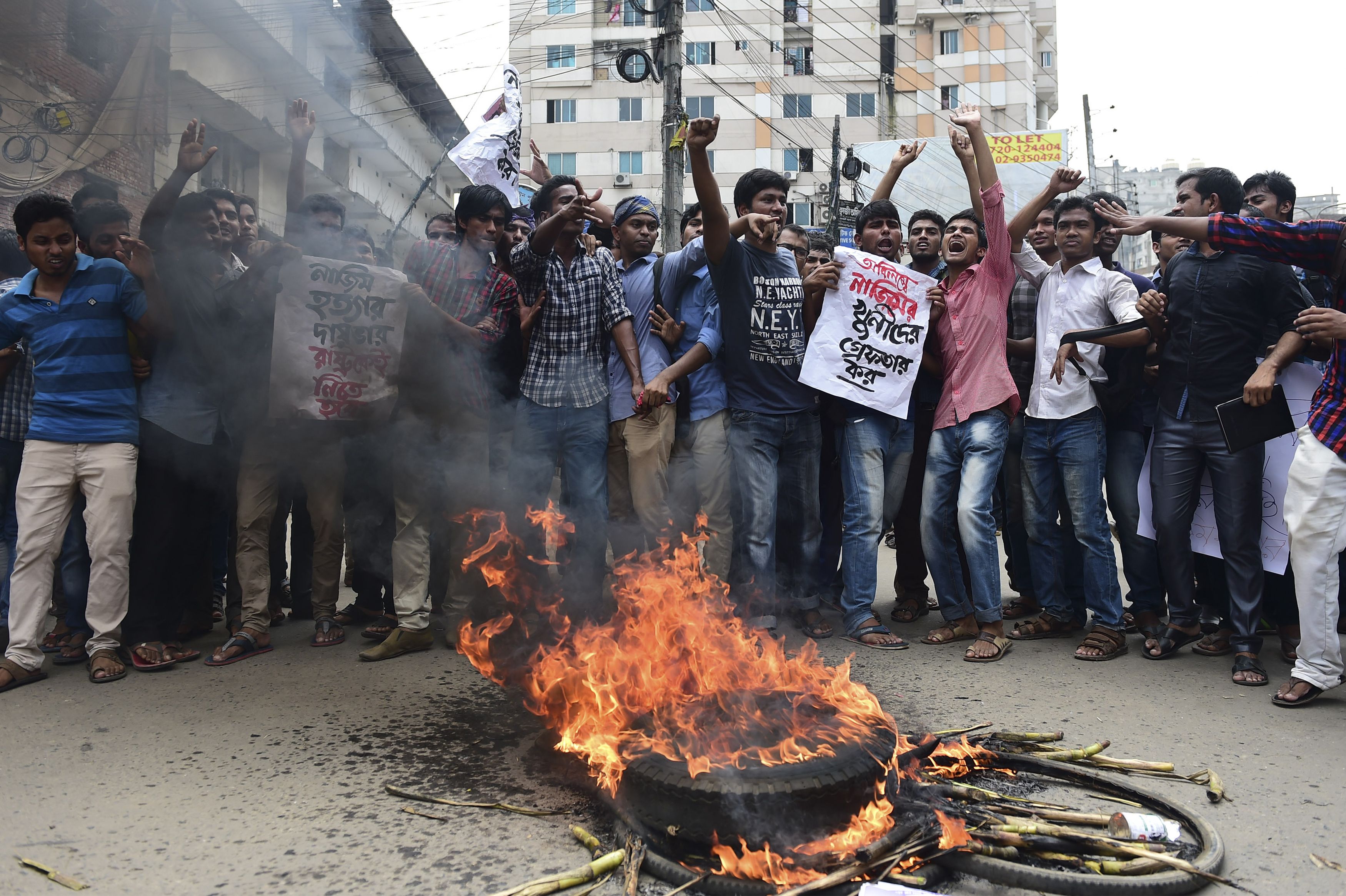 Bangladeshi students block the road and stage a protest following the murder of a law student who posted against Islamism on Facebook and was hacked to death by four assailants the night before, in Dhaka on April 7, 2016. (MUNIR UZ ZAMAN—AFP/Getty Images)