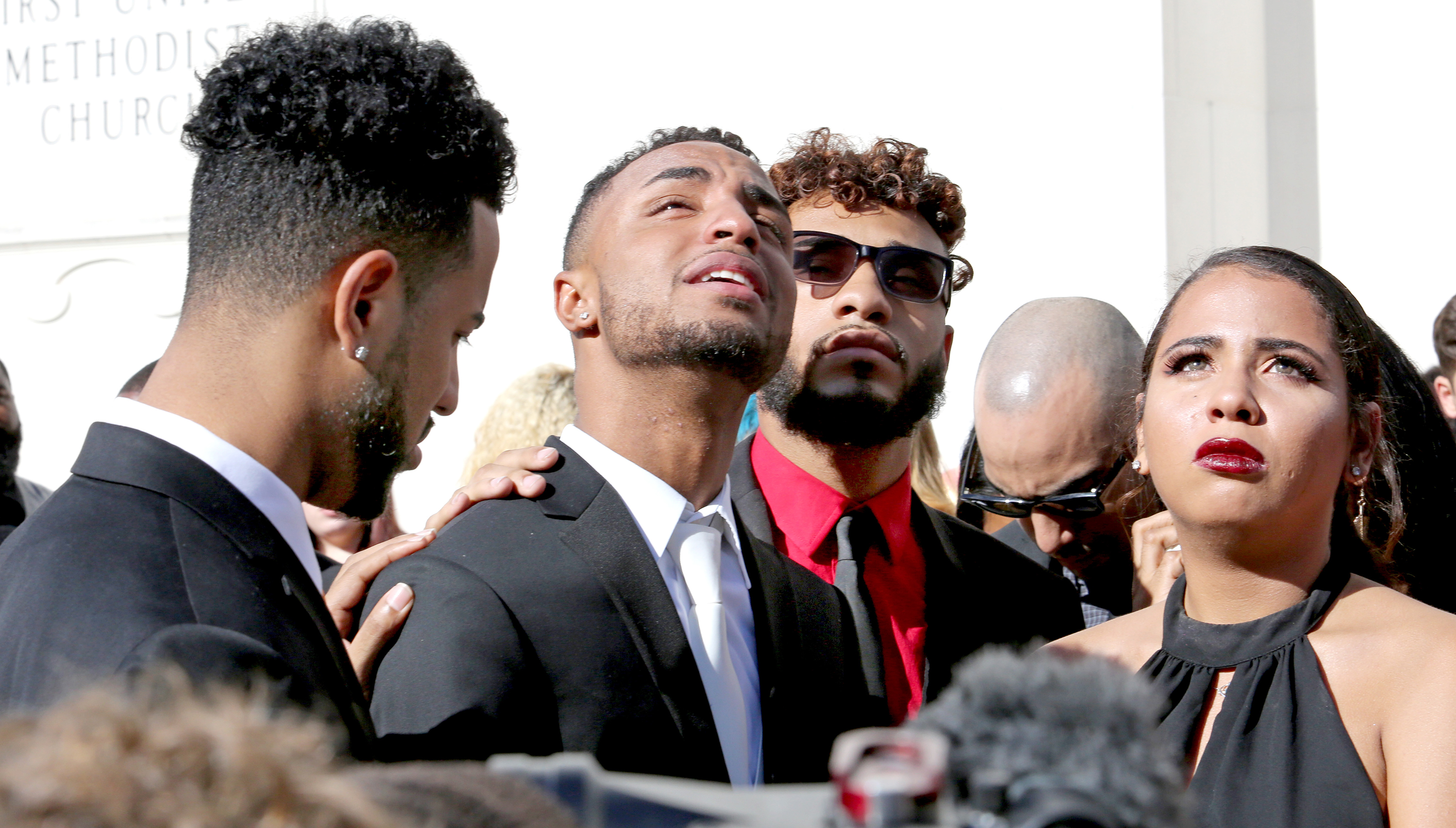 Robert Presley, Isaiah Henderson, an unidentified family member and Tatiana Harris during the funeral for their mother Brenda Lee Marquez McCool in Orlando, Fla., on June 20, 2016 (Orlando Sentinel/TNS/Getty Images)