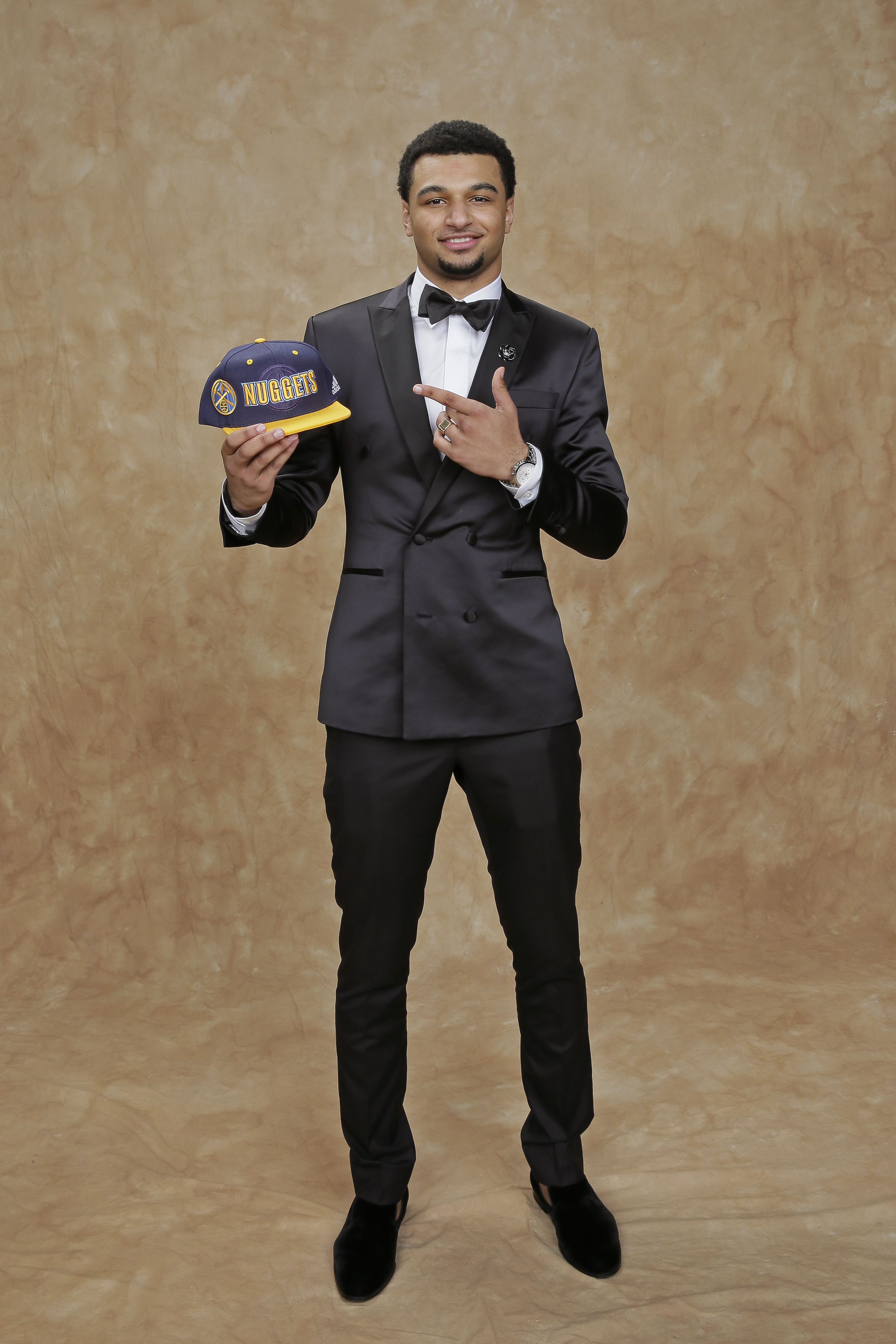 Jamal Murray updated his classic tuxedo look by opting for a sleek satin material.