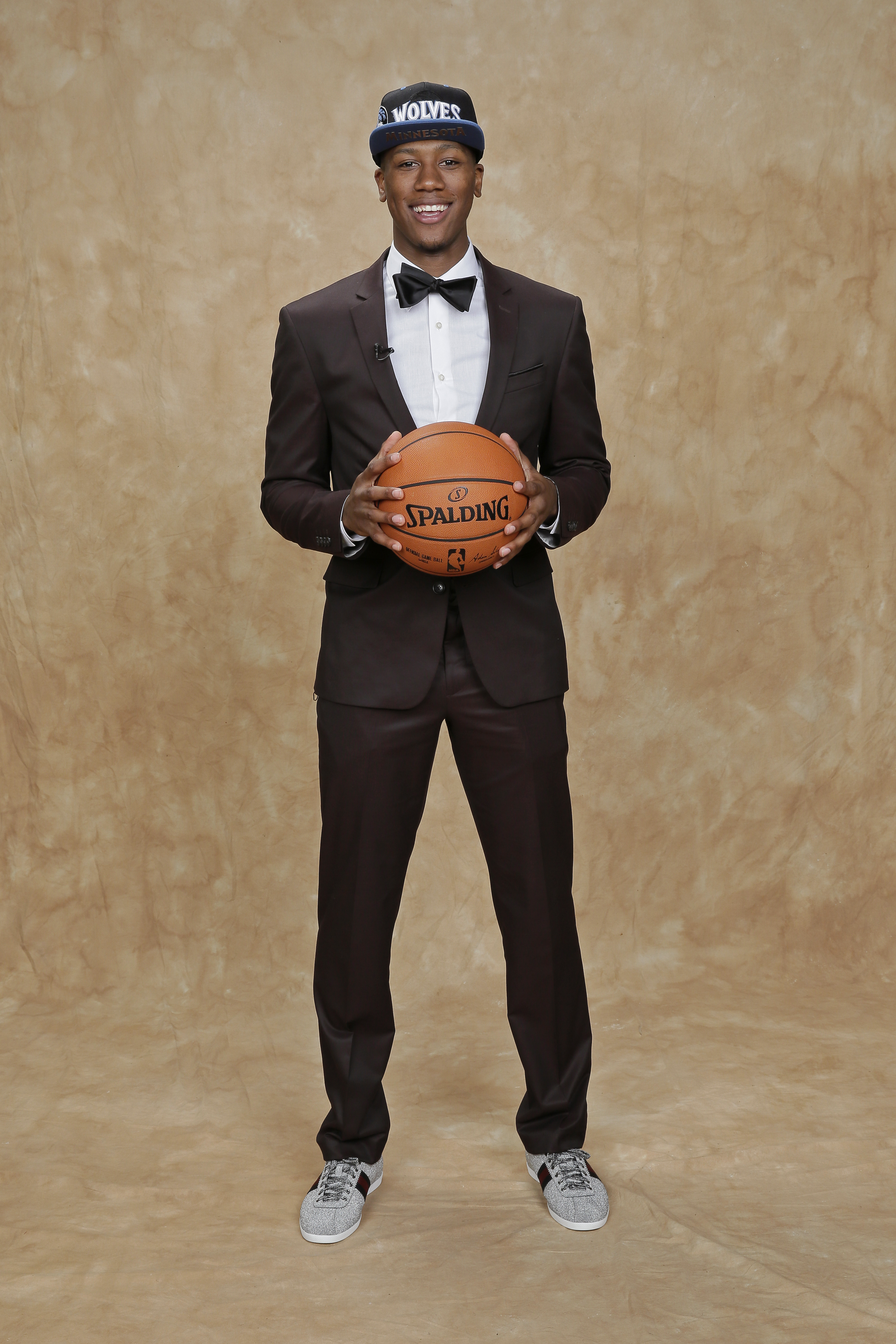 Kris Dunn proved that the best style can come from an appreciation of a high-low aesthetic. Case in point? His dapper JC Penney suit paired with a pair of sparkling silver Gucci sneakers.