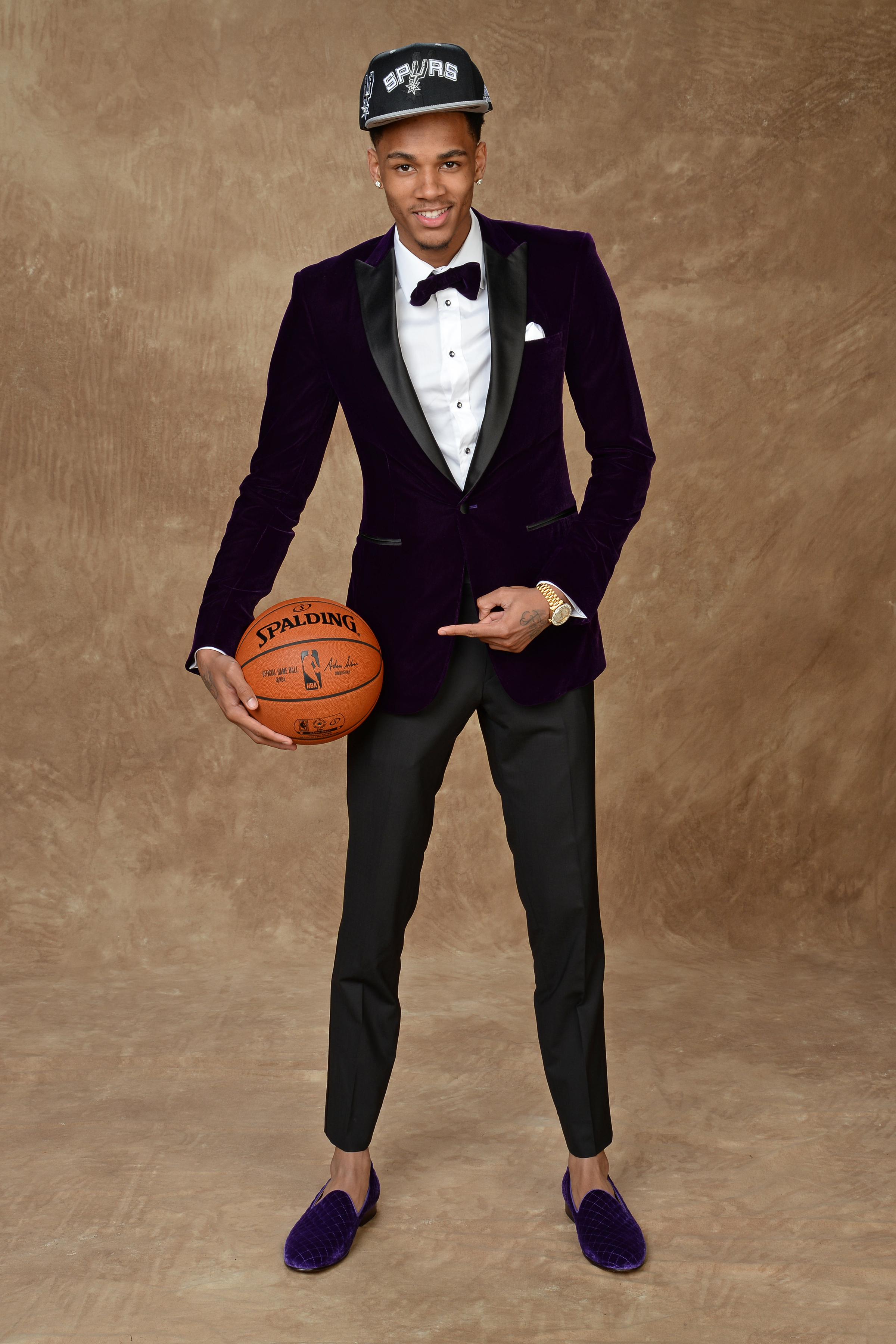Dejounte Murray opted for a luxurious velvet tuxedo jacket, which he paired with royal purple velvet smoking slippers.