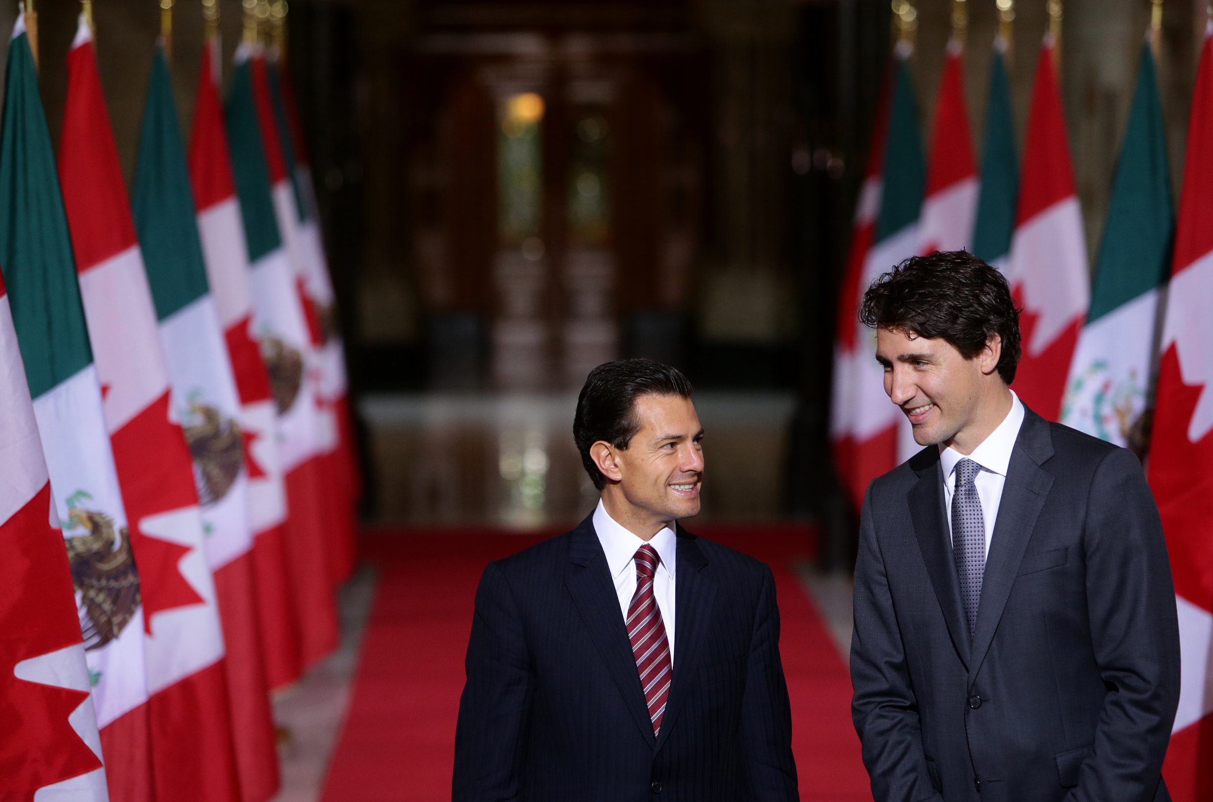 Justin Trudeau, Canada's prime minister, right, smiles with Enrique Pena Nieto, Mexico's president, in the Hall of Honour at Parliament Hill ahead of the North American Leaders Summit (NALS) in Ottawa, Ontario, Canada, on June 28, 2016.