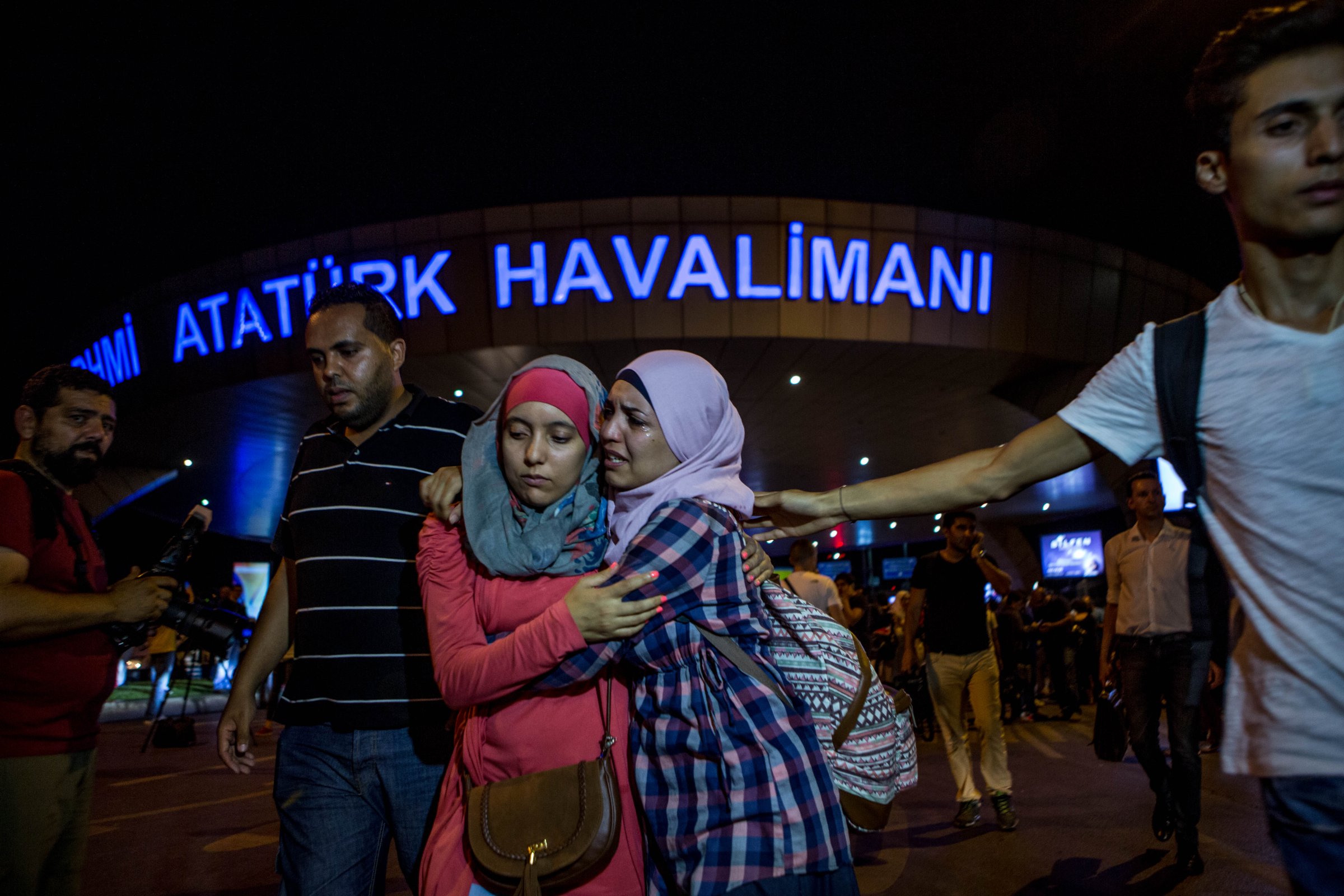 Passengers leave Istanbul Ataturk Airport, Turkey's largest airport, after a suicide-bomb attack in the early hours of in Istanbul on June 29, 2016.
