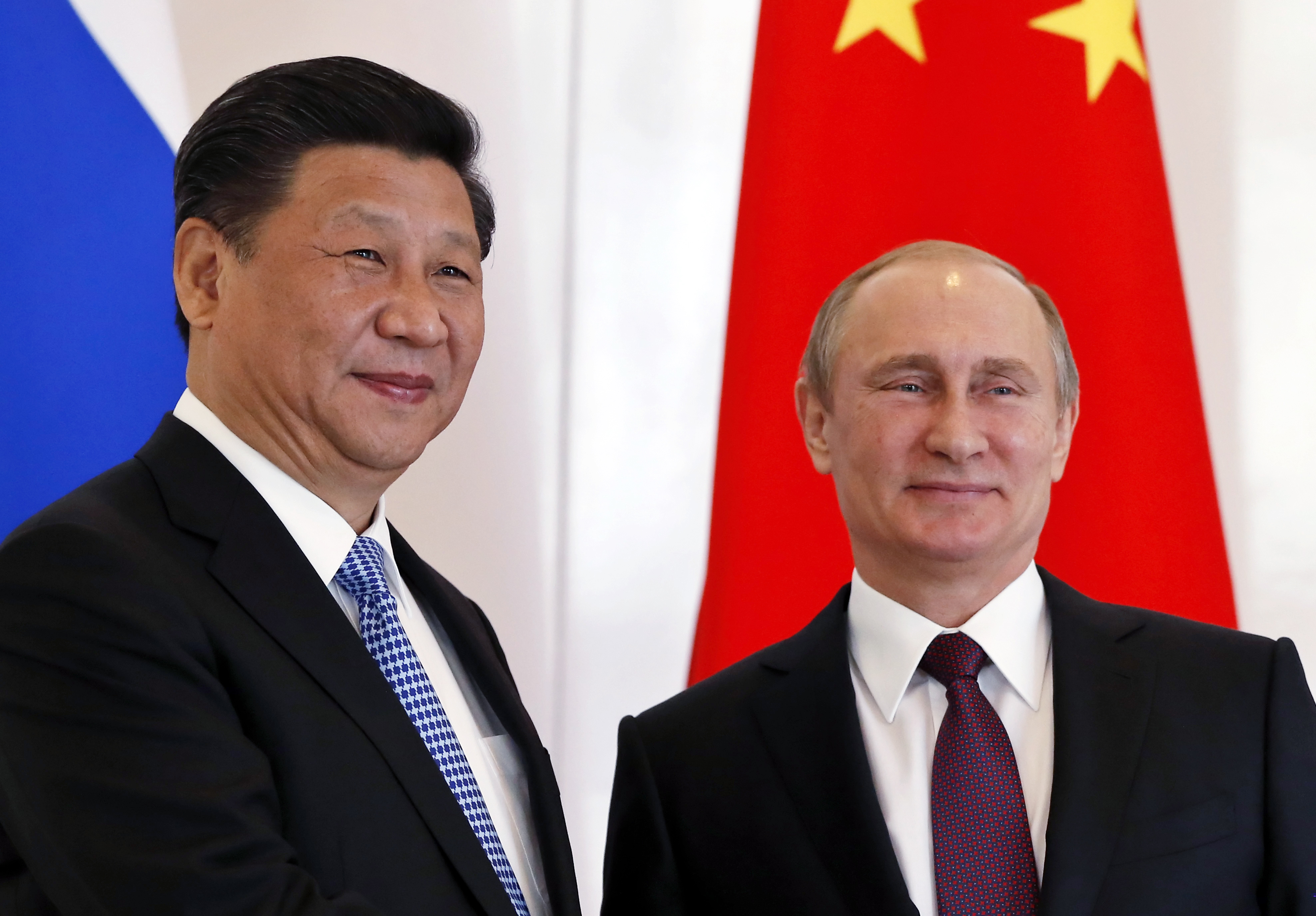 Russian President, Vladimir Putin, right, poses with Chinese President Xi Jinping during the BRICS leaders' meeting in Turkey on Nov. 15, 2015 (Yuri Kochetkov—EPA)