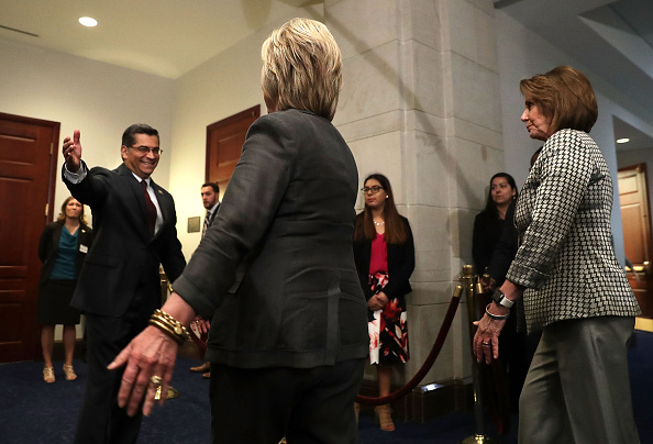 Democratic presidential candidate Hillary Clinton (C) is greeted by House Democratic Caucus Chair Xavier Becerra (D-CA) (L) as House Minority Leader Rep. Nancy Pelosi (D-CA) (R) looks on as she arrives to meet with House Democrats June 22, 2016 on Capitol Hill in Washington, DC. (Alex Wong&mdash;Getty Images)