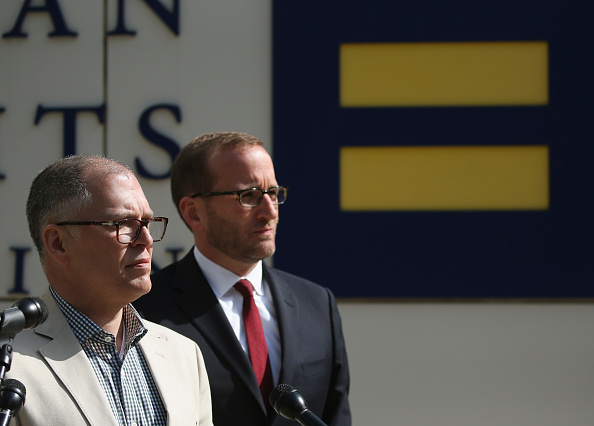 Plaintiff James Obergefell (L) is flanked by Human Rights Campaign President Chad Griffin (R), speaks about his case before tomorrow's arguments at the US Supreme Court April 27, 2015 in Washington, DC.
