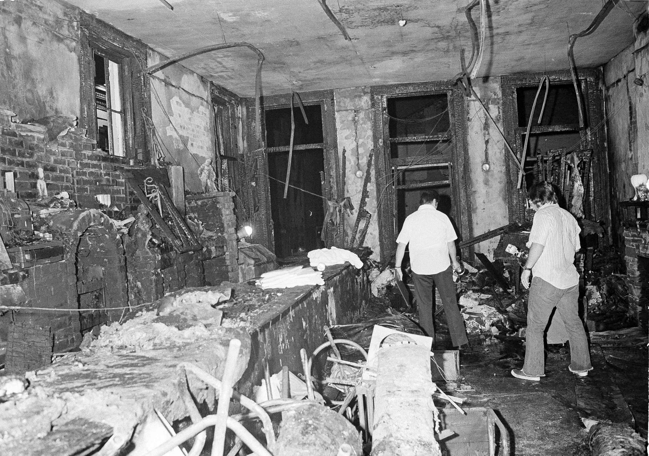 This is a view inside the UpStairs bar following a flash fire that left 29 dead and 15 injured, June 25, 1973. Most of the victims were found near the windows in the background. The bar is located in the New Orleans French Quarter. (Jack Thornell—AP)