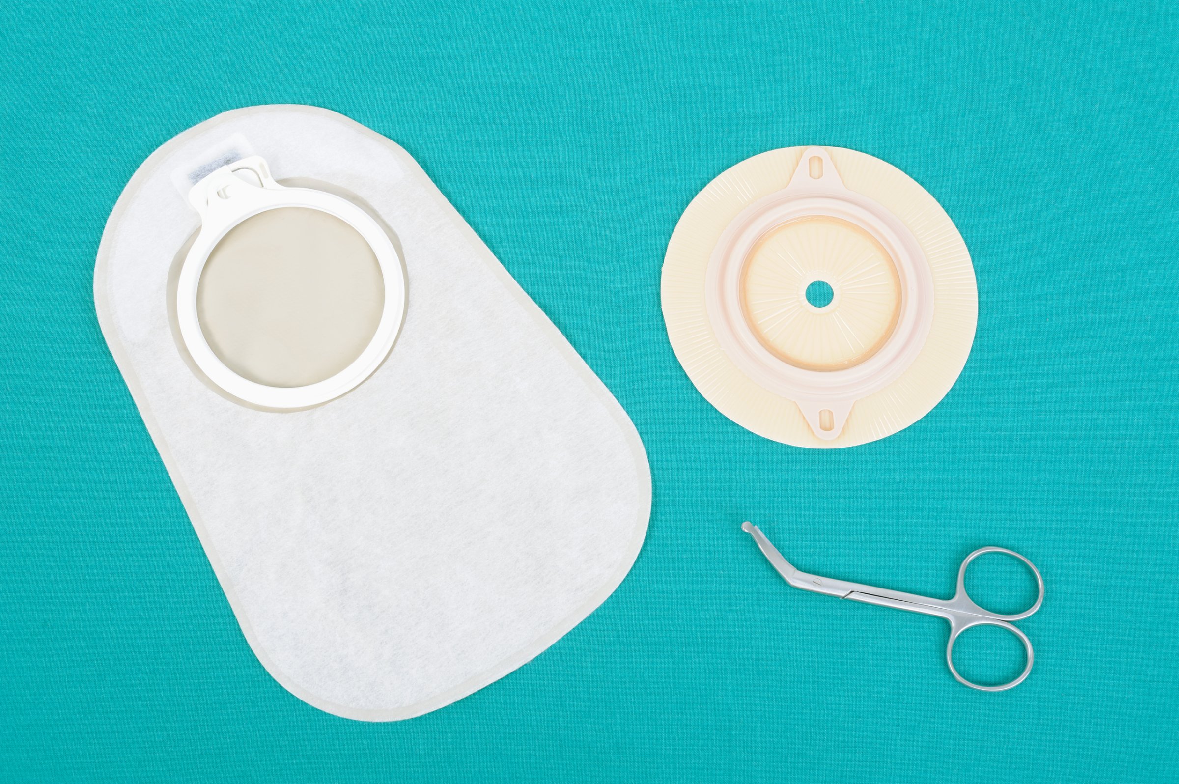 Ostomy supplies, accessory bag and disk with scissors for colostomy