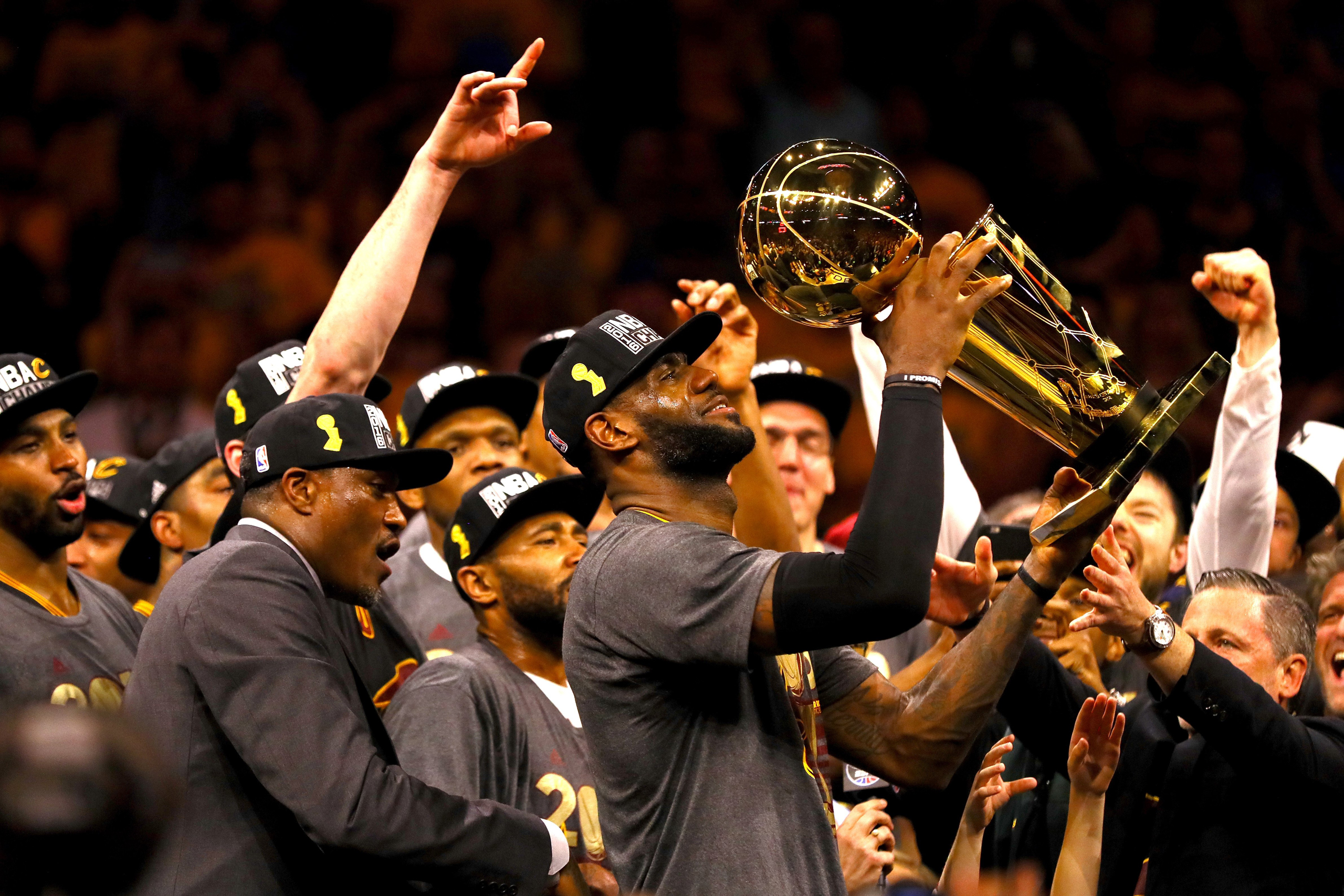 LeBron James #23 of the Cleveland Cavaliers holds the Larry O'Brien Championship Trophy after defeating the Golden State Warriors 93-89 in Game 7 of the 2016 NBA Finals at ORACLE Arena on June 19, 2016 in Oakland, California. NOTE TO USER: User expressly acknowledges and agrees that, by downloading and or using this photograph, User is consenting to the terms and conditions of the Getty Images License Agreement.  (Photo by Ezra Shaw/Getty Images) (Ezra Shaw—Getty Images)