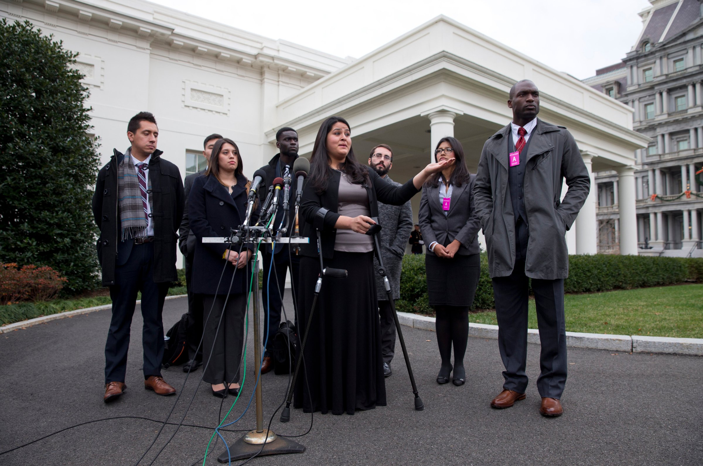 Lorella Praeli representing the group United We DREAM, with a group of immigrant youth who were eligible for the president's deferred action, speaks to the media on Dec. 4, 2014.