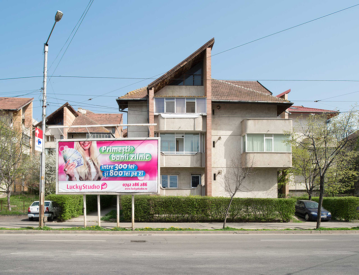 A Lucky Studio billboard shows daily earnings for models in Iași, northeastern Romania, April 2016.
