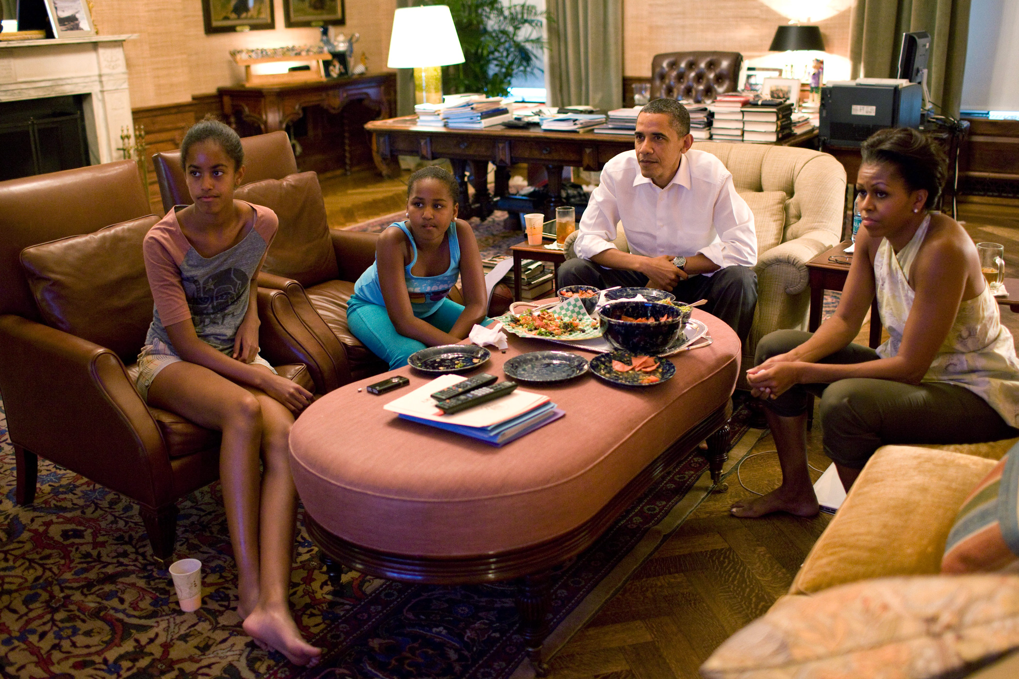 July 17, 2011 In this handout provided by the White House, President Barack Obama and first lady Michelle Obama with their daughters Sasha and Malia watch a World Cup soccer match from the Treaty Room office in the residence of the White House.