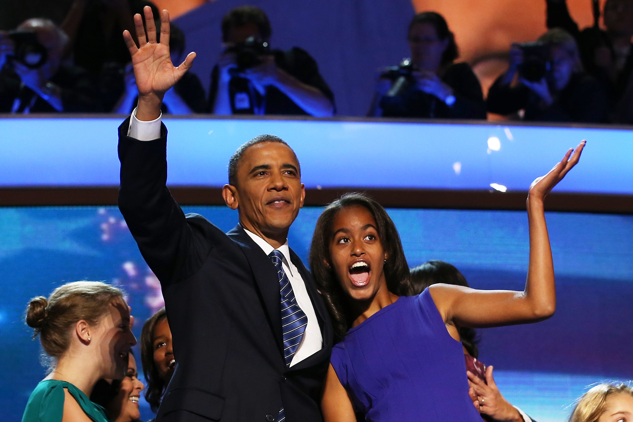 Sept. 6, 2012 President Barack Obama waves on stage with daughter Malia Obama after accepting the nomination during the final day of the Democratic National Convention at Time Warner Cable Arena in Charlotte, N.C.
