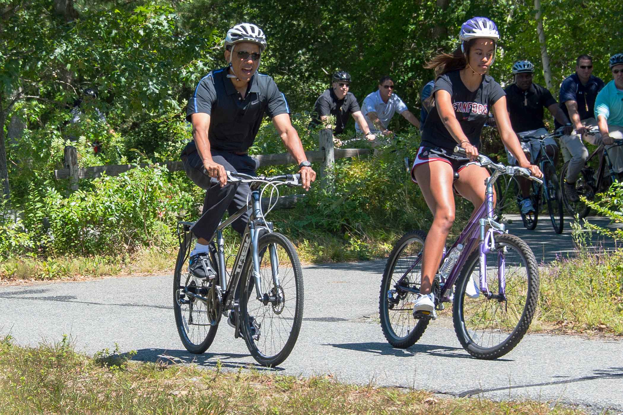 Aug. 15, 2014 
                              
                              President Barack Obama and daughter Malia Obama ride bikes along the Correllus State Bike Path outside of West Tisbury, Martha's Vineyard, Mass.