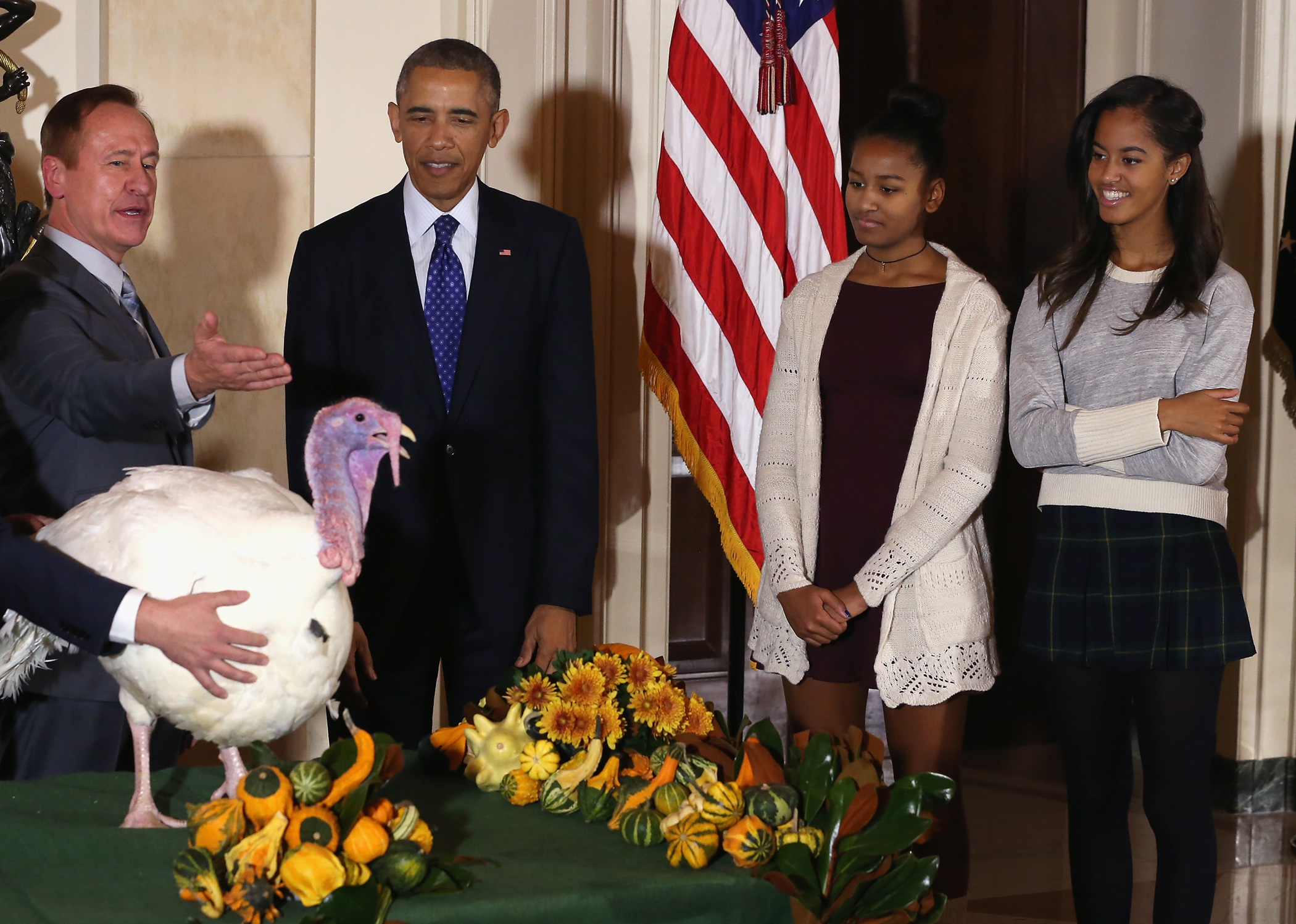 Nov. 26, 2014 President Barack Obama pardoned "Cheese" the Turkey, as his daughters Malia and Sasha watch a ceremony at the White House.