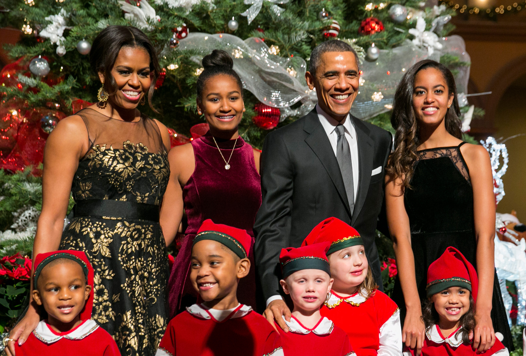 Dec.14, 2014
                              President Barack Obama, first lady Michelle Obama and daughters Sasha and Malia pose with  elves  prior to the taping of  Christmas in Washington.