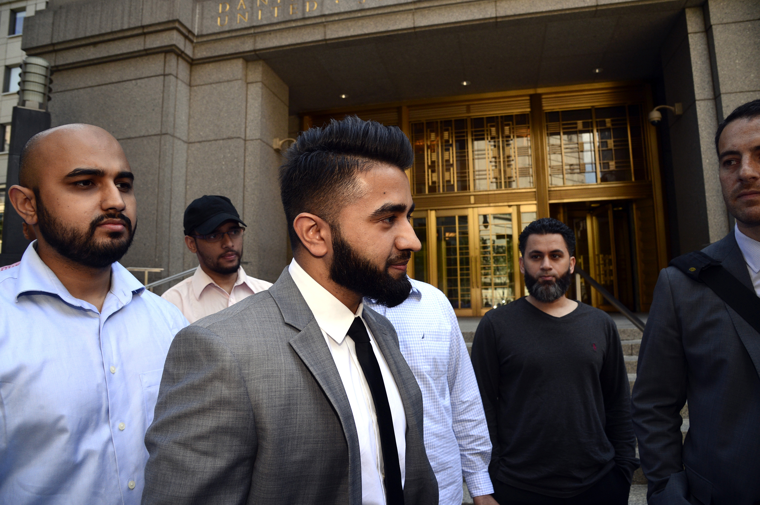 New York Police Department officer Masood Syed, center, leaves Manhattan Federal Court on June 22, 2016. Sayed, a Sunni Muslim, filed a lawsuit against the city for suspending him from the force over the length of his beard. (Jefferson Siegel—NY Daily News/Getty Images)