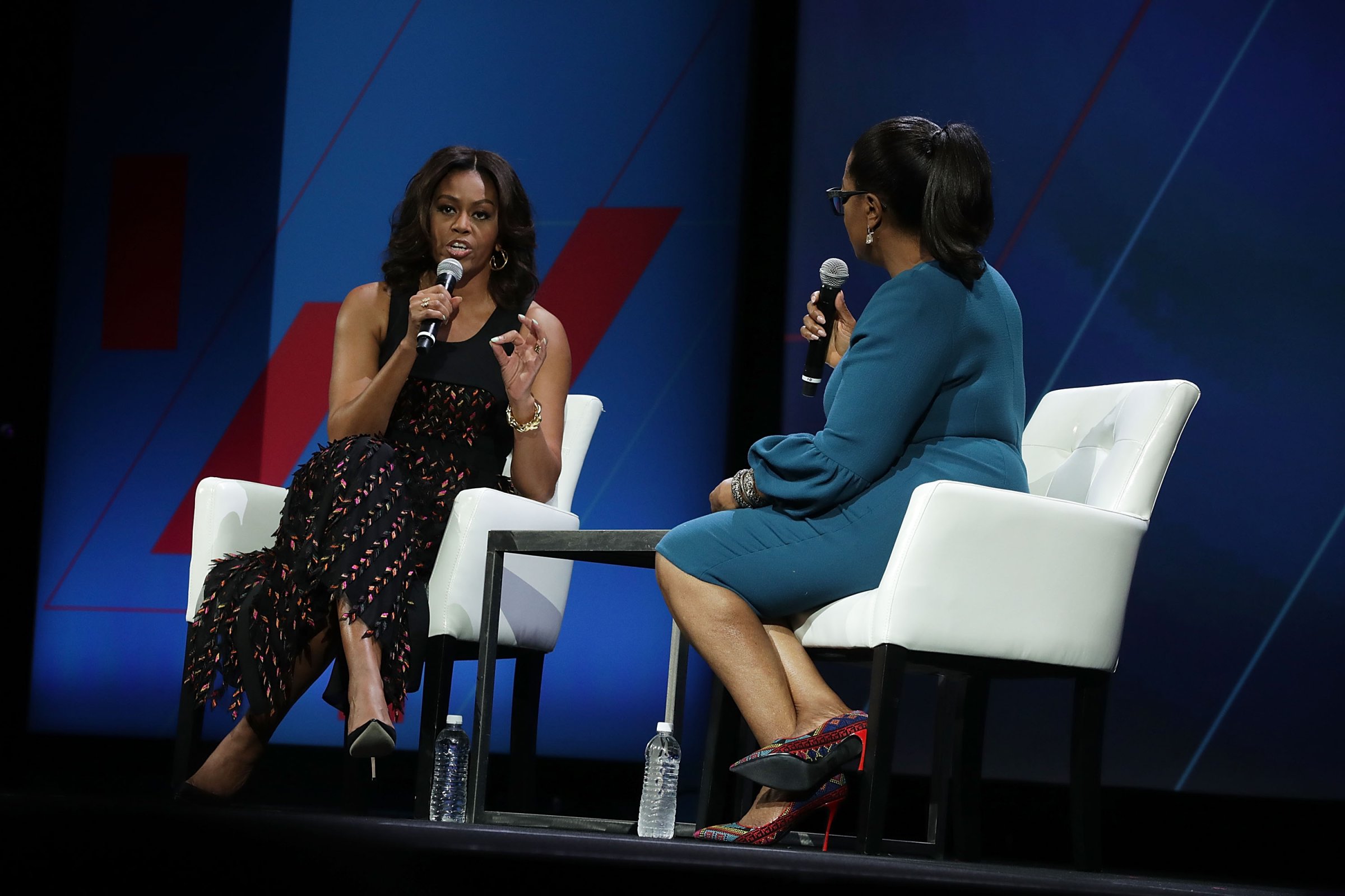 U.S. first lady Michelle Obama (L) and Oprah Winfrey (R) participate in a conversation on "Trailblazing the Path for the Next Generation of Women" during the White House Summit on the United State Of Women June 14, 2016 in Washington, DC. The White House hosts the first ever summit to push for gender equality.