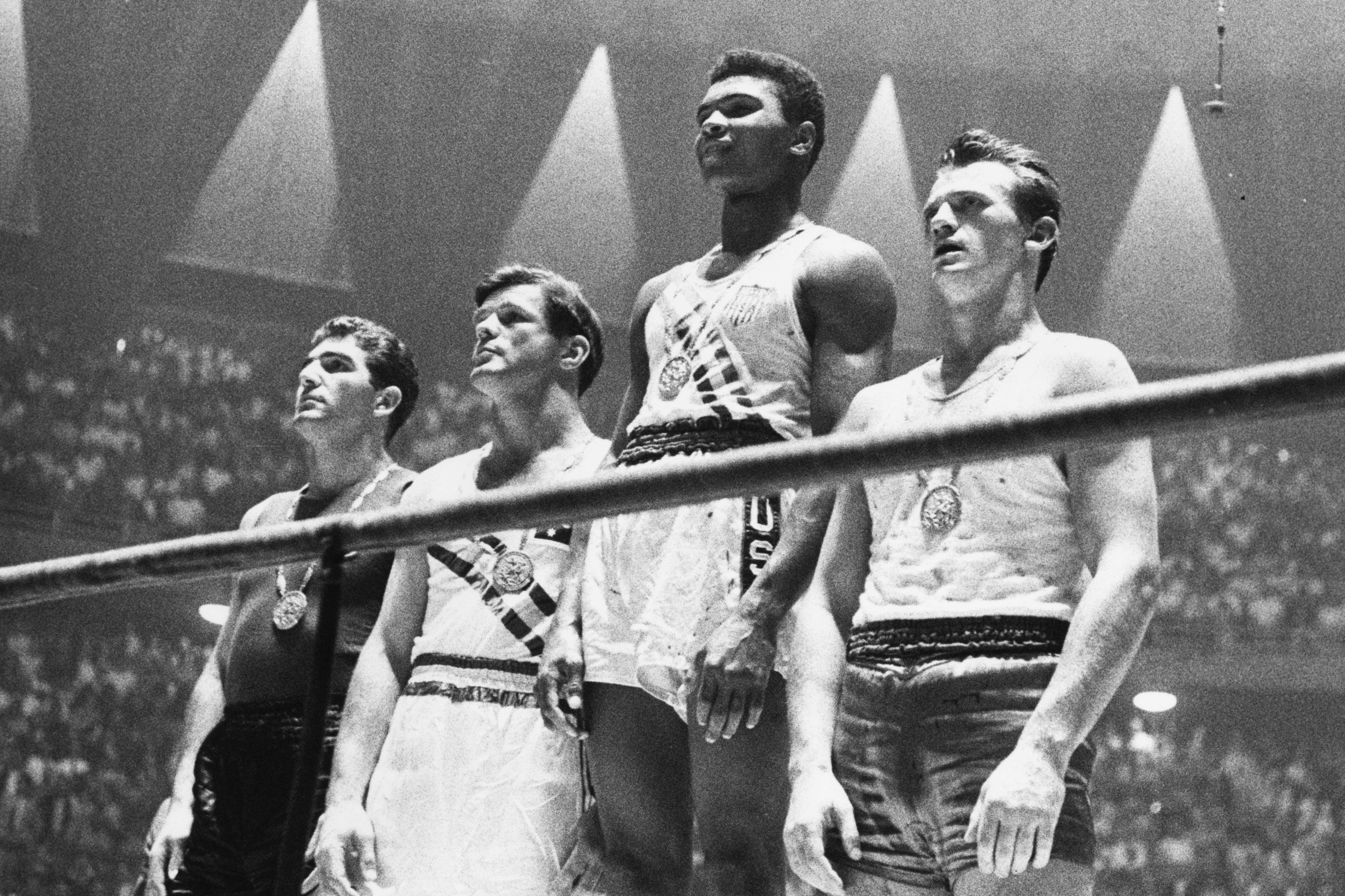 Muhammad Ali, second from right, and the winners of the 1960 Olympic medals for light heavyweight boxing on the winners' podium in Rome.