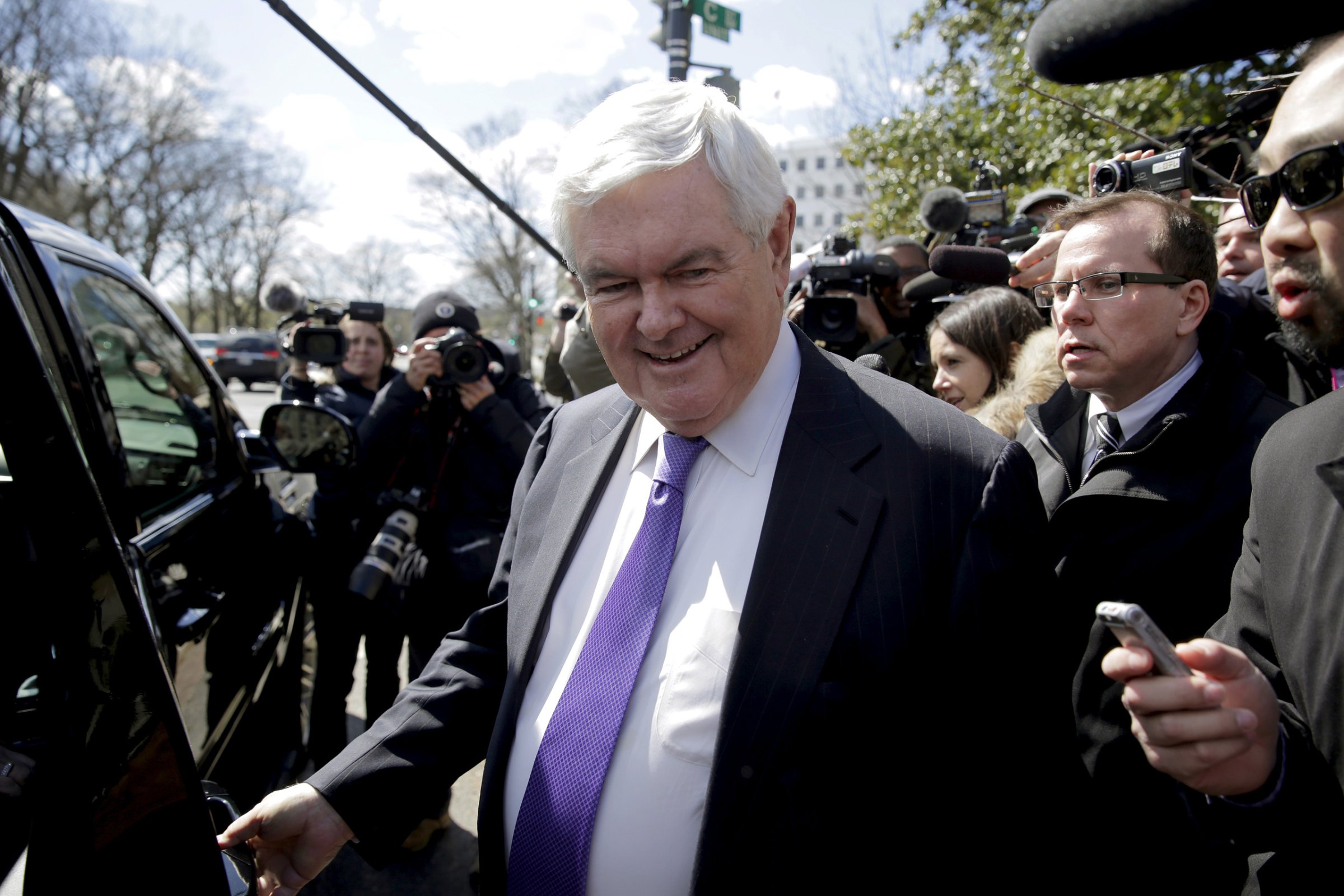 Newt Gingrich is followed by the media as he walks from a meeting with Republican presidential candidate Donald Trump in Washington, March 21, 2016.