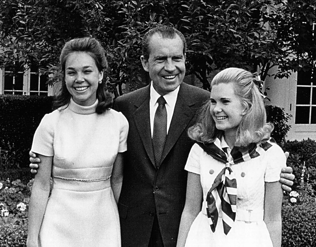 President Richard Nixon with his daughters, Julie(left) and Tricia(right), June 13, 1969 at the White House. (National Archives / Getty Images)