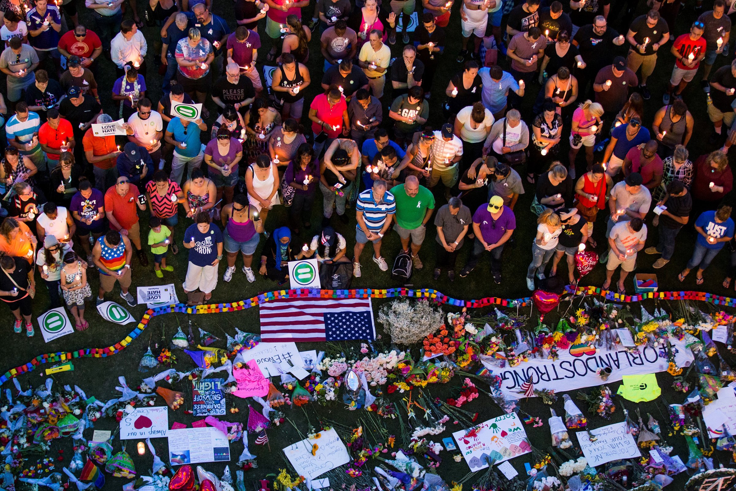 Thousands gather at the Dr. Phillips Center for the Performing Arts to pay their respects for those lost in the Pulse nightclub shooting in Orlando, Fla., on June 13, 2016.