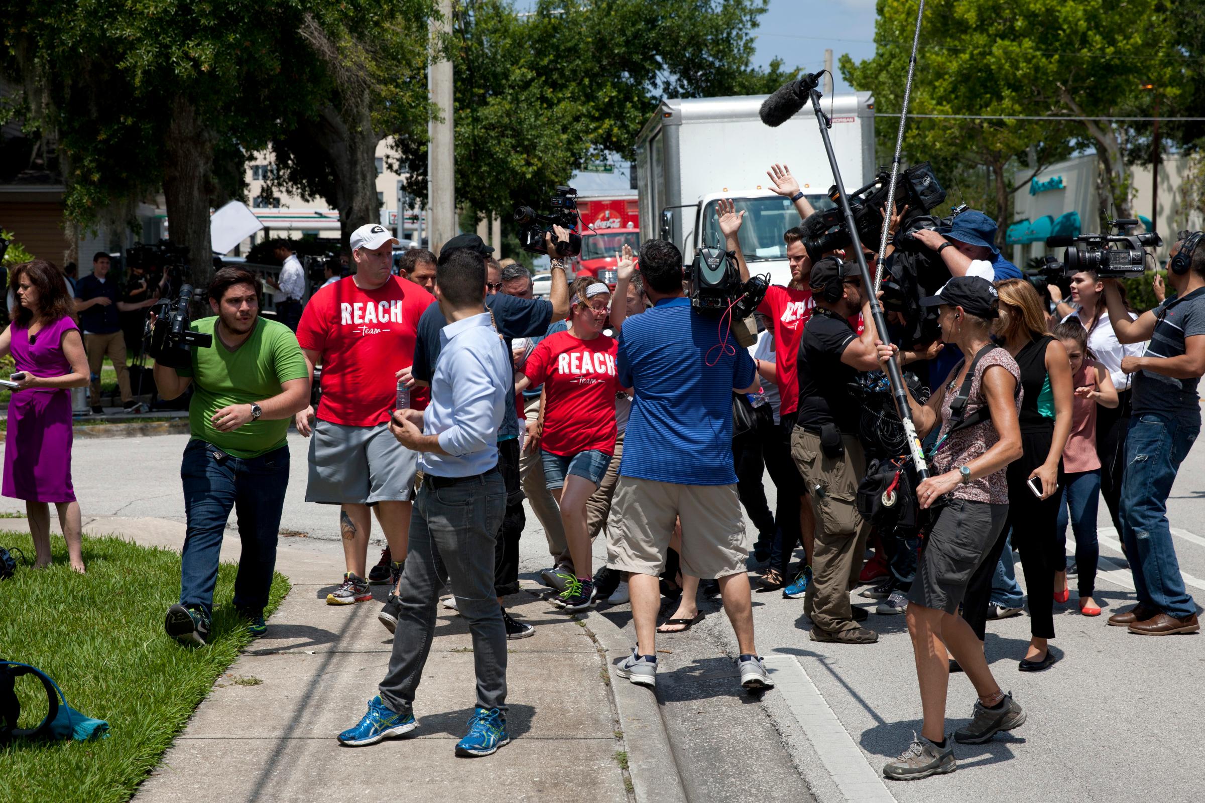 Reporters wait to interview relatives of victims of the Pulse nightclub shooting in Orlando, Fla., on June 13, 2016.