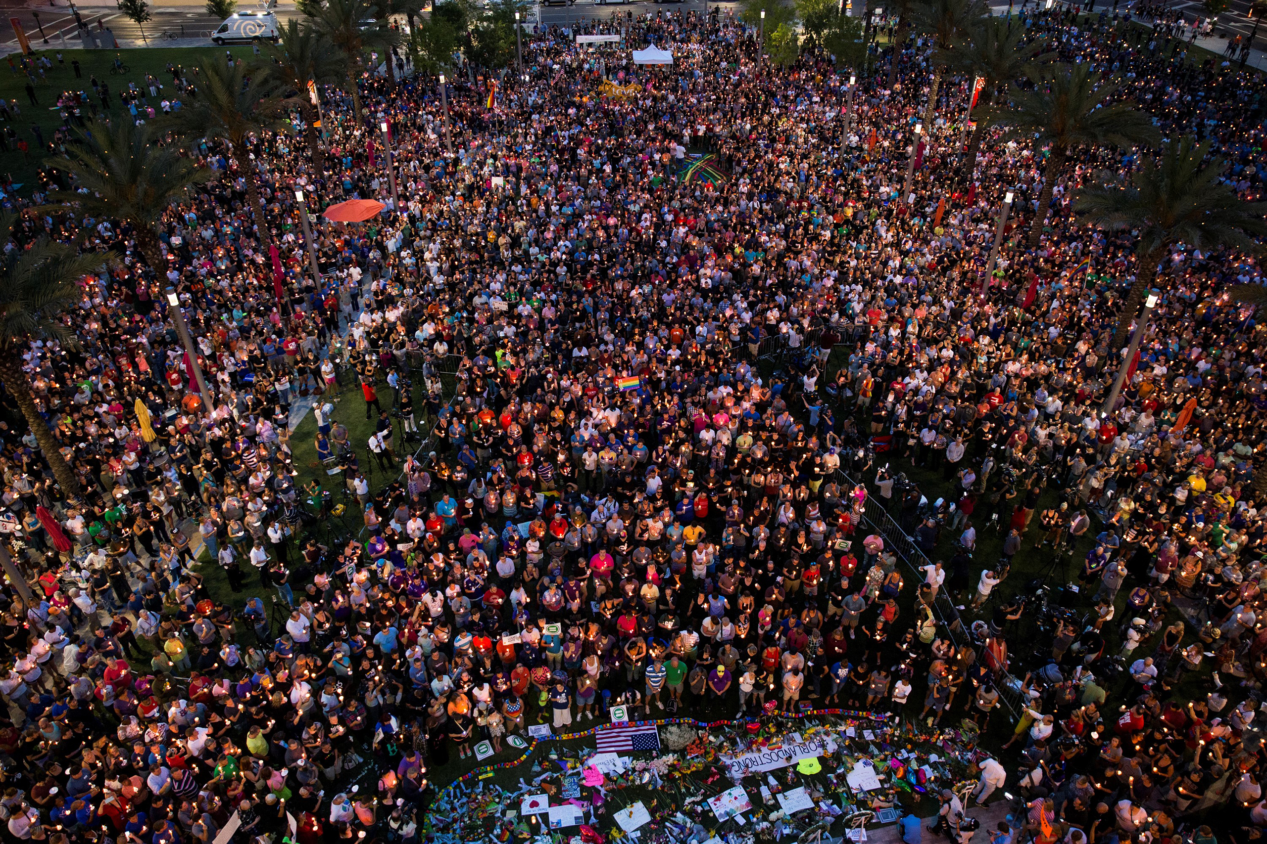 Thousands gather at the Dr. Phillips Center for the Performing Arts to pay their respects for those lost in the Pulse nightclub shooting in Orlando on June 13, 2016. 
                      
                      
                      Candlelight vigils and remembrances for the victims of the shooting at Pulse, a gay nightclub in Orlando, Florida. Early Sunday, an American-born man who had recently pledged allegiance to ISIS opened fire in the nightclub killing at least 49 people, in the worst mass shooting in U.S. history. (Samuel Corum—Anadolu Agency/Getty Images)