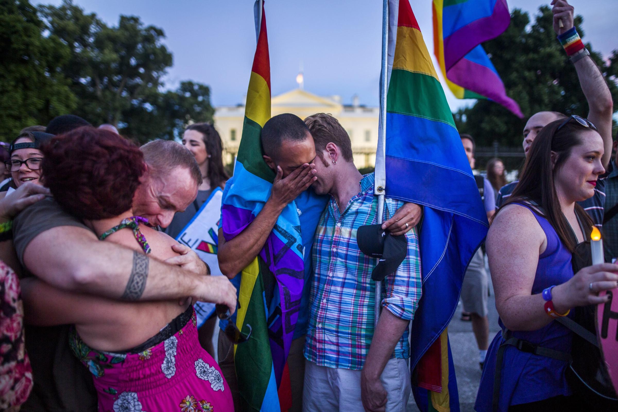 Members and supporters of the lesbian, gay, transgender, bisexual and queer (LGTBQ) community attend a candlelight vigil outside the White House in Washington, D.C., June 12 2016.