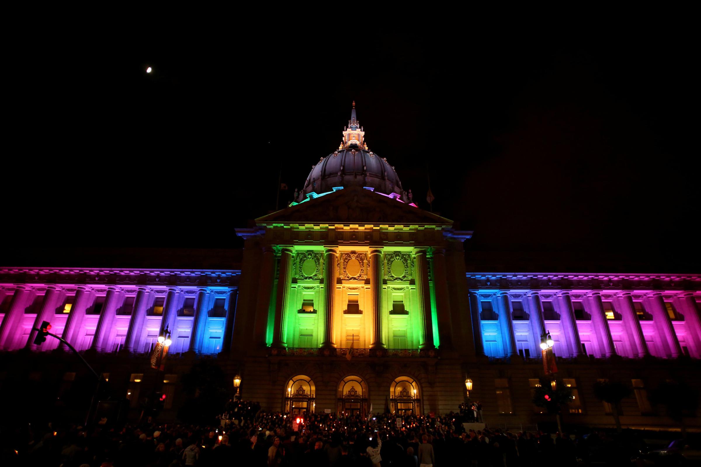 People attend a candlelight vigil for the victims of the Orlando attack against a gay night club, held in San Francisco, June 12, 2016.