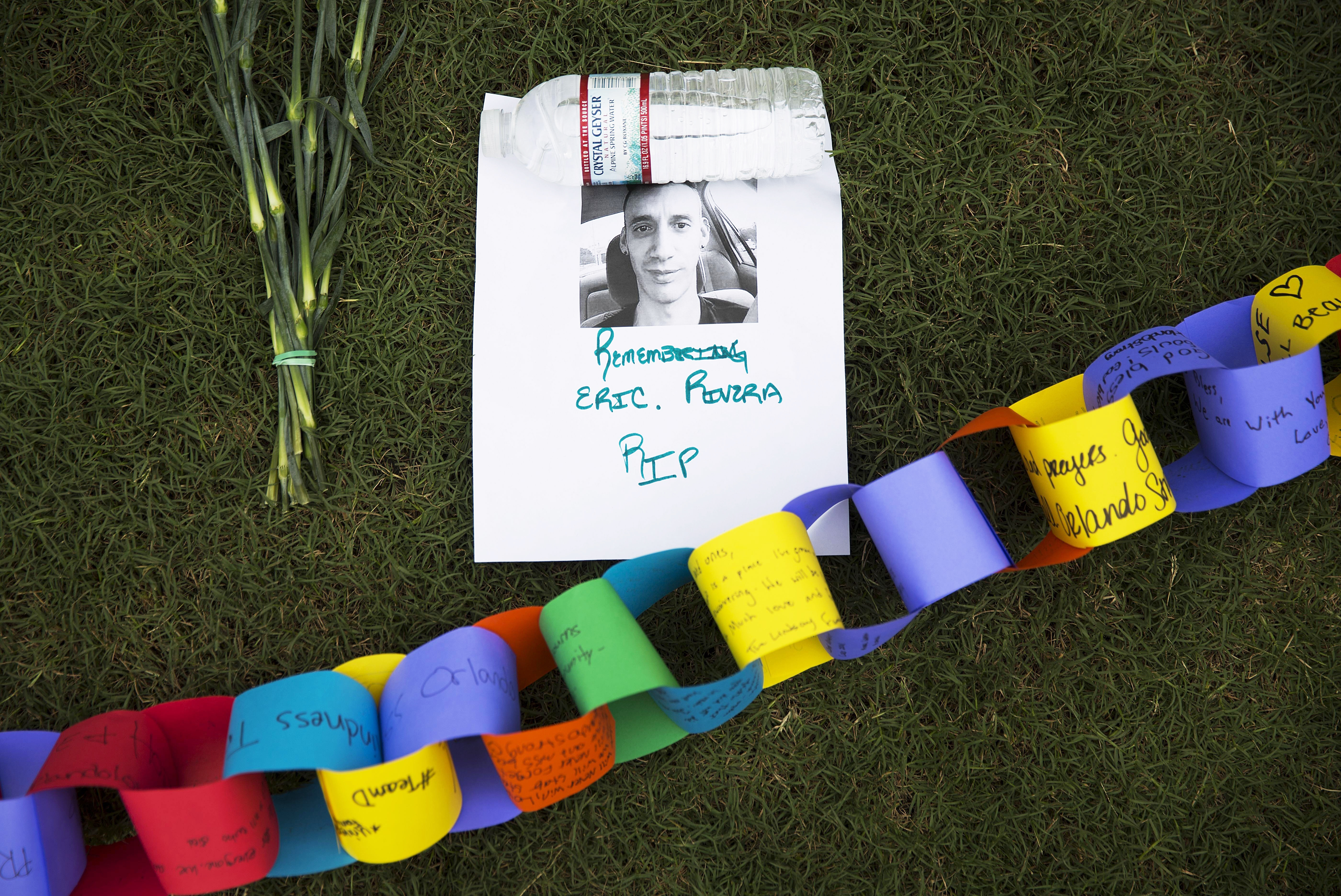 A remembrance for Eric Rivera, killed in the mass shooting at the Pulse nightclub, sits amongst a makeshift memorial for the victims in Orlando, Fla., on June 13, 2016.