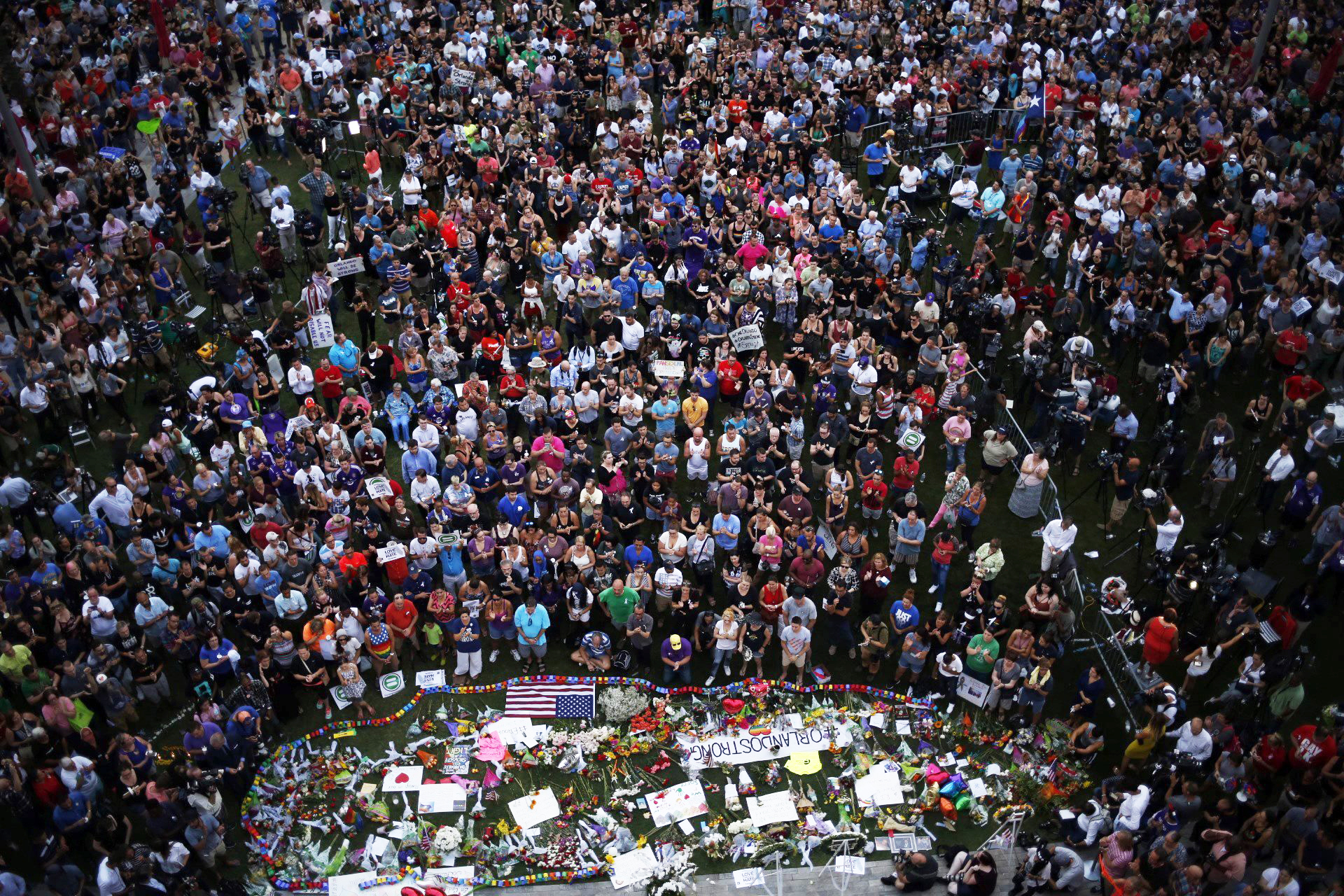Hundreds of people gather at a memorial outside of the Dr. Phillips Center for the Performing Arts in Orlando, Fla., on June 13, 2016.