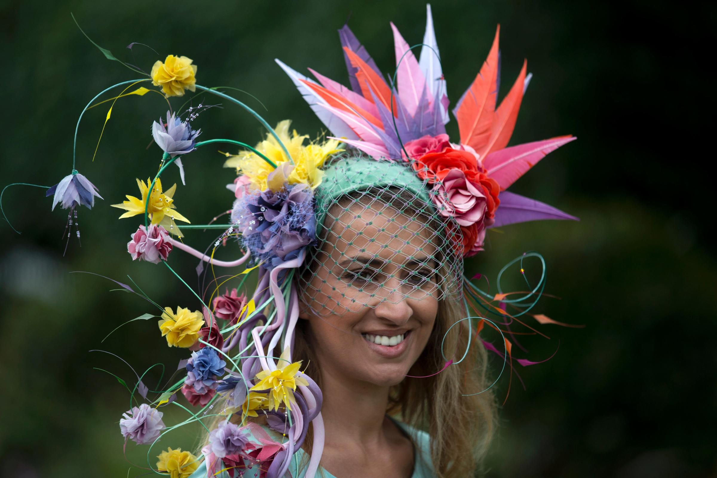 A racegoer poses for photographers on the first day on the first day of the Royal Ascot horse racing meet, in Ascot, west of London, on June 14, 2016. / AFP PHOTO / JUSTIN TALLISJUSTIN TALLIS/AFP/Getty Images
