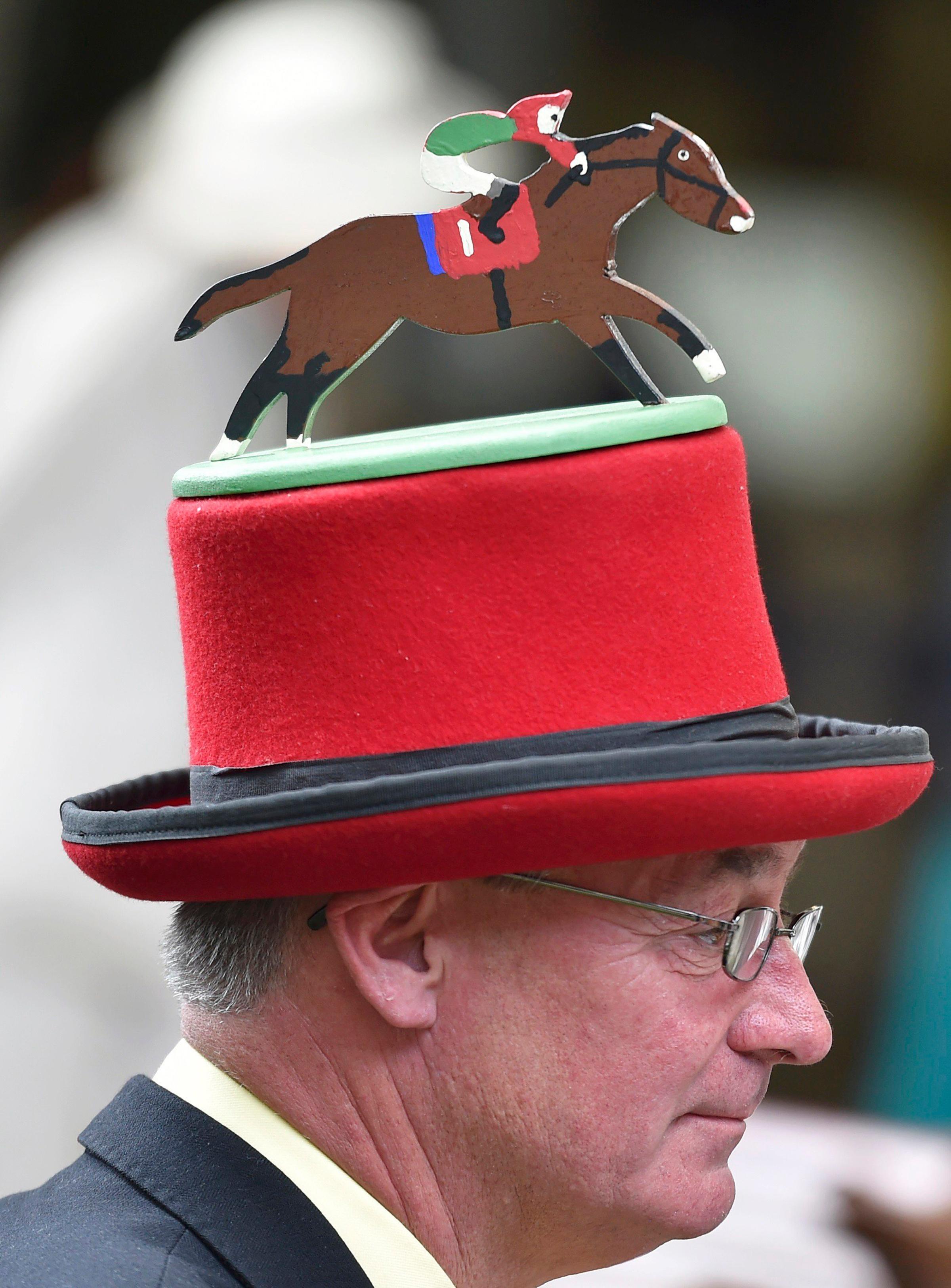 Britain Horse Racing - Royal Ascot - Ascot Racecourse - 16/6/16 Ladies Day Racegoer wears hat Reuters / Toby Melville