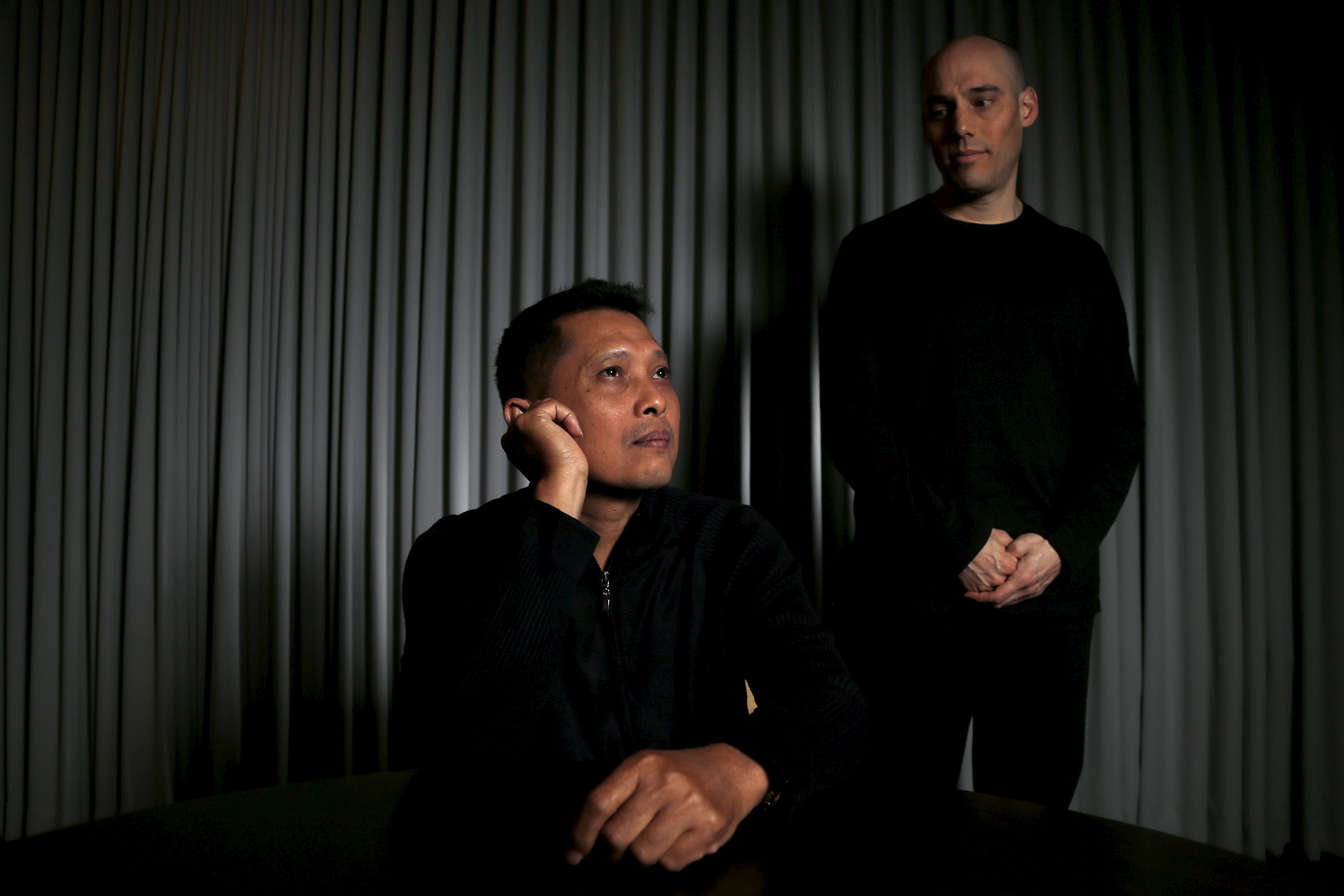 Joshua Oppenheimer, right, director of the documentary <i>The Look of Silence</i>, and Adi Rukun, whose brother Ramli Rukun was killed during the violence described in the documentary, pose for a portrait in Beverly Hills, Calif., on Feb. 9, 2016. Shot in Indonesia and nominated for an Oscar, the documentary is at once a source of national pride and of shame for the world's third largest democracy (Mario Anzuoni—Reuters)
