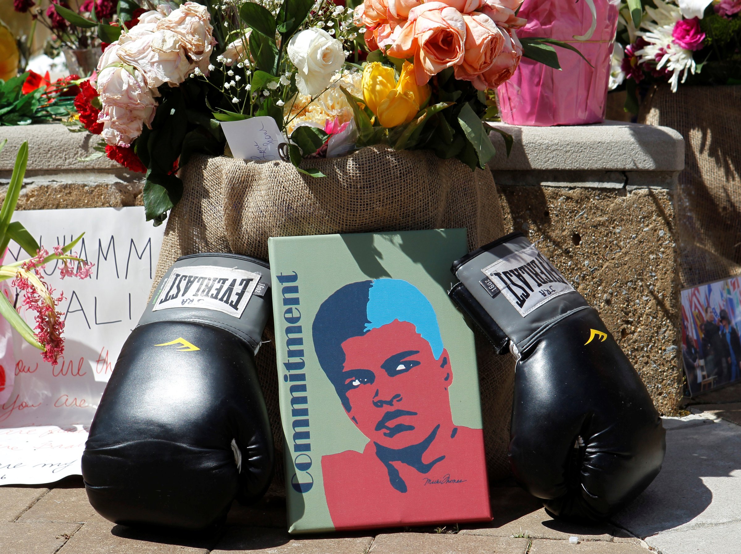 Fans of Muhammad Ali leave pictures and personal mementos as they pay their respects at the Ali Center in Louisville