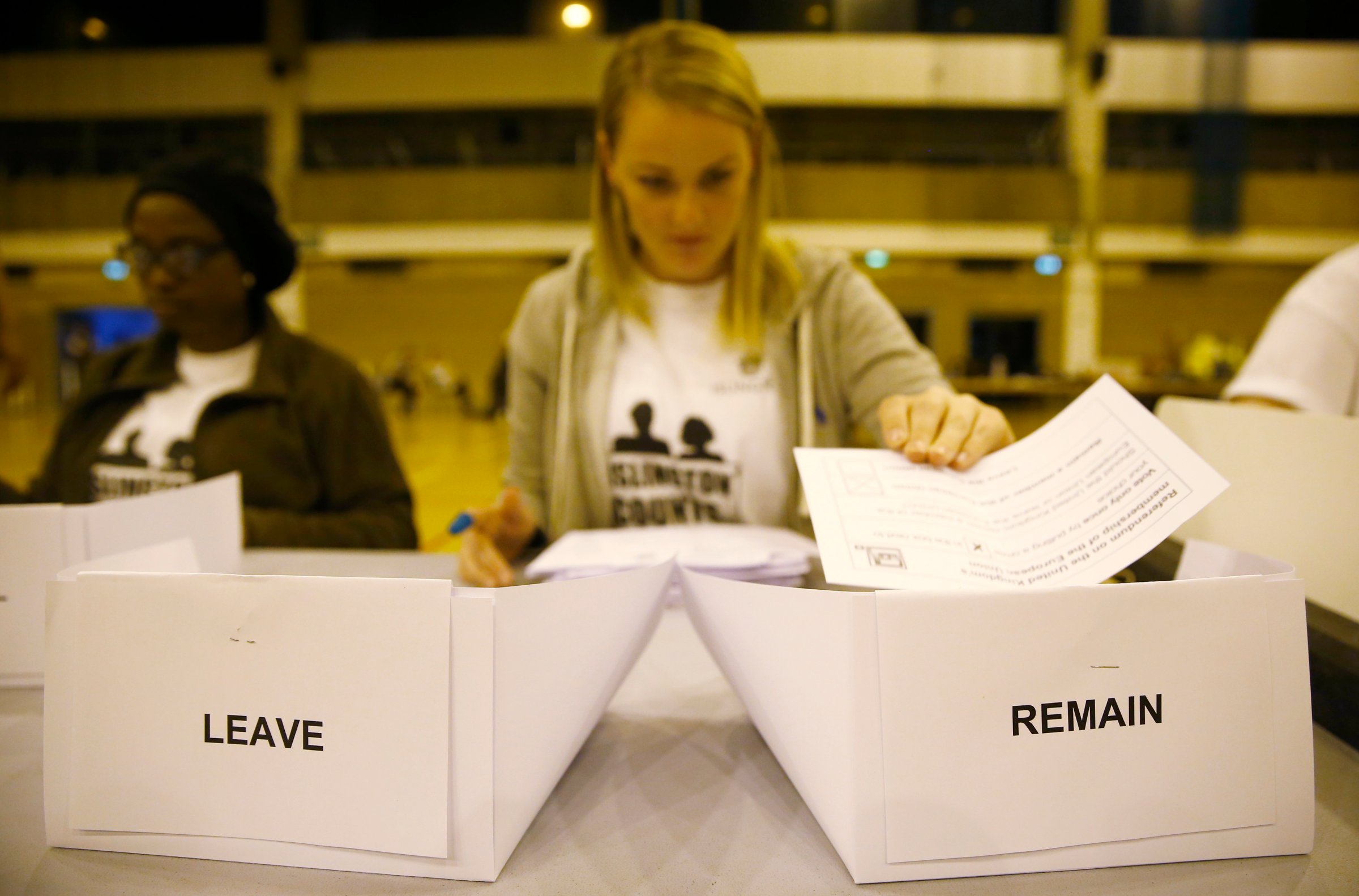 A workers counts ballots after polling stations closed in the Referendum on the European Union in Islington, London