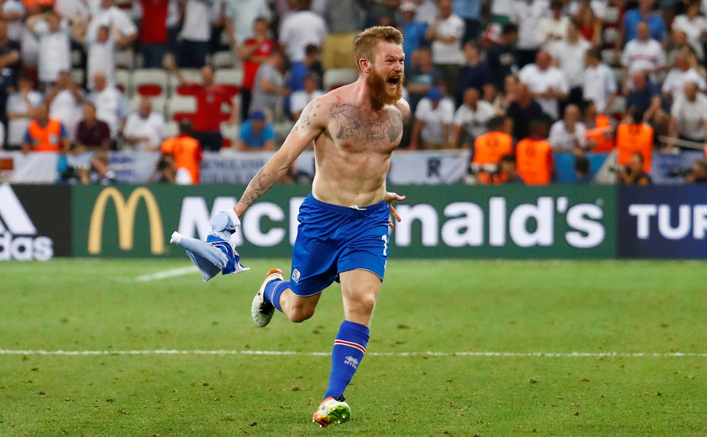 Iceland's Aron Gunnarsson celebrates after Iceland defeat England 2-1 in the Stade de Nice, Nice, France, at the Euro 2016 soccer tournament on June 27, 2016 (Reuters Staff—REUTERS)