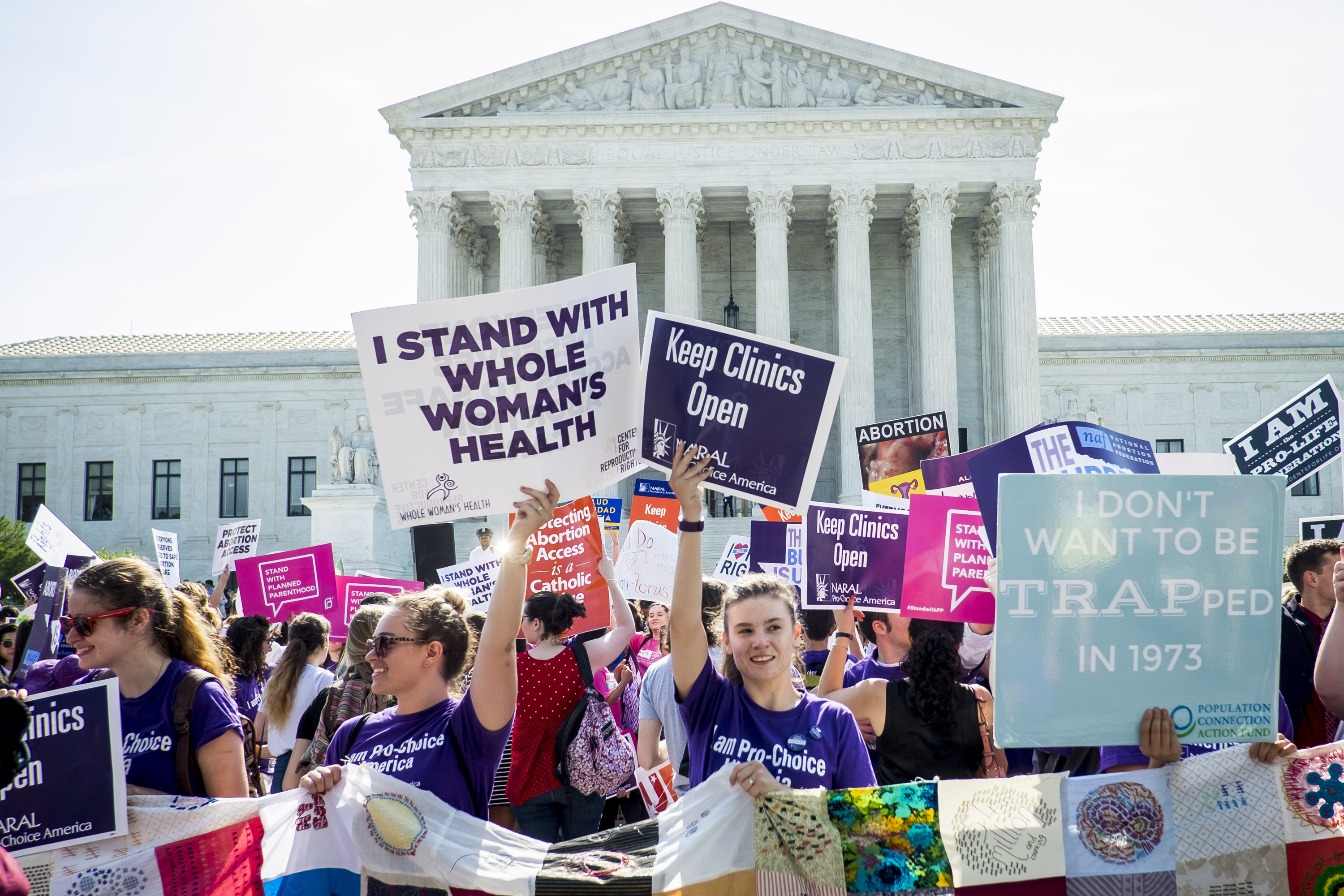 Pro-choice and pro-life activists demonstrate on the steps of the United States Supreme Court in Washington, D.C. on June 27, 2016. (Pete Marovich—Getty Images)