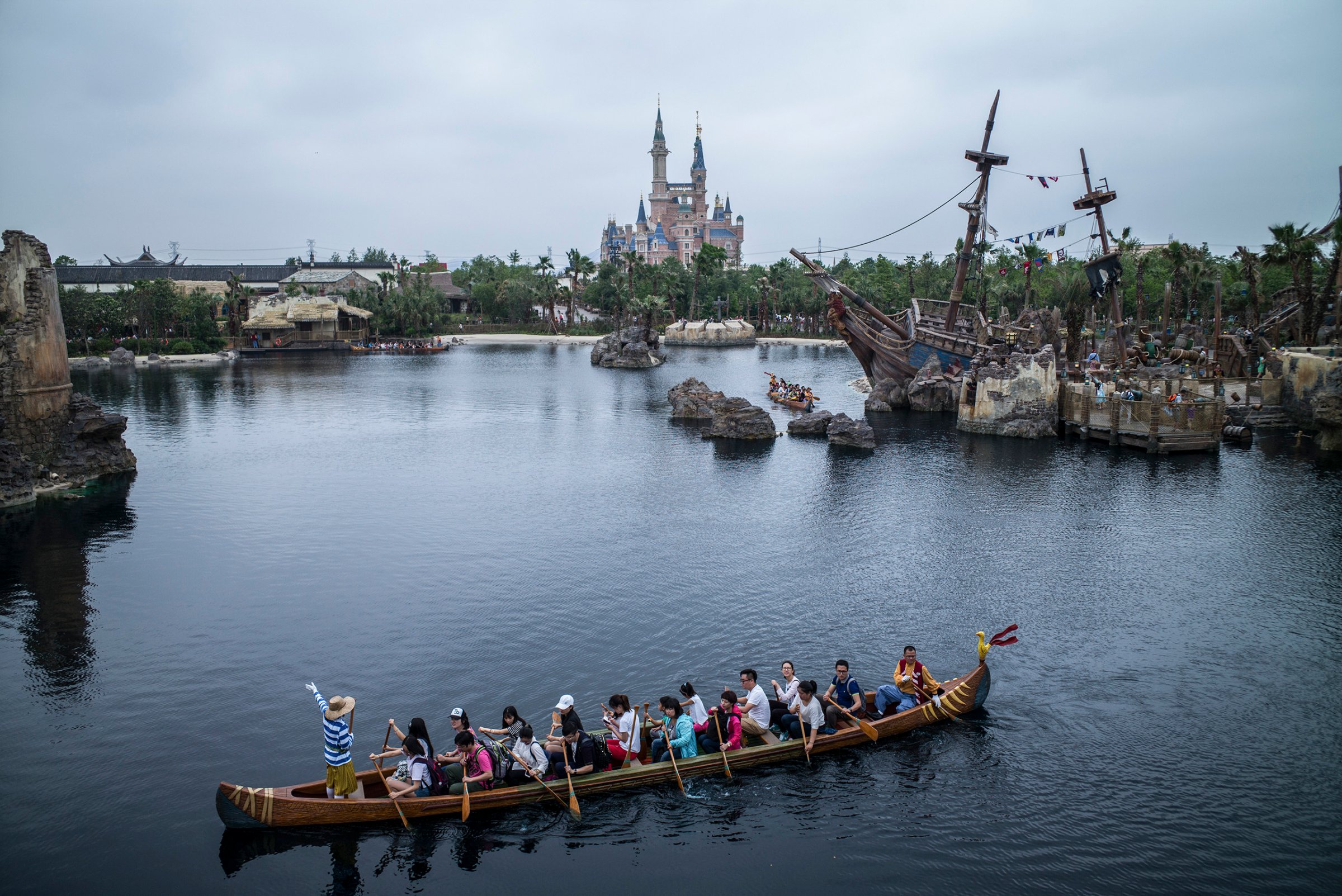 Visitors take the canoe ride at Treasure Cove during a preview at Shanghai Disneyland, June 10, 2016.