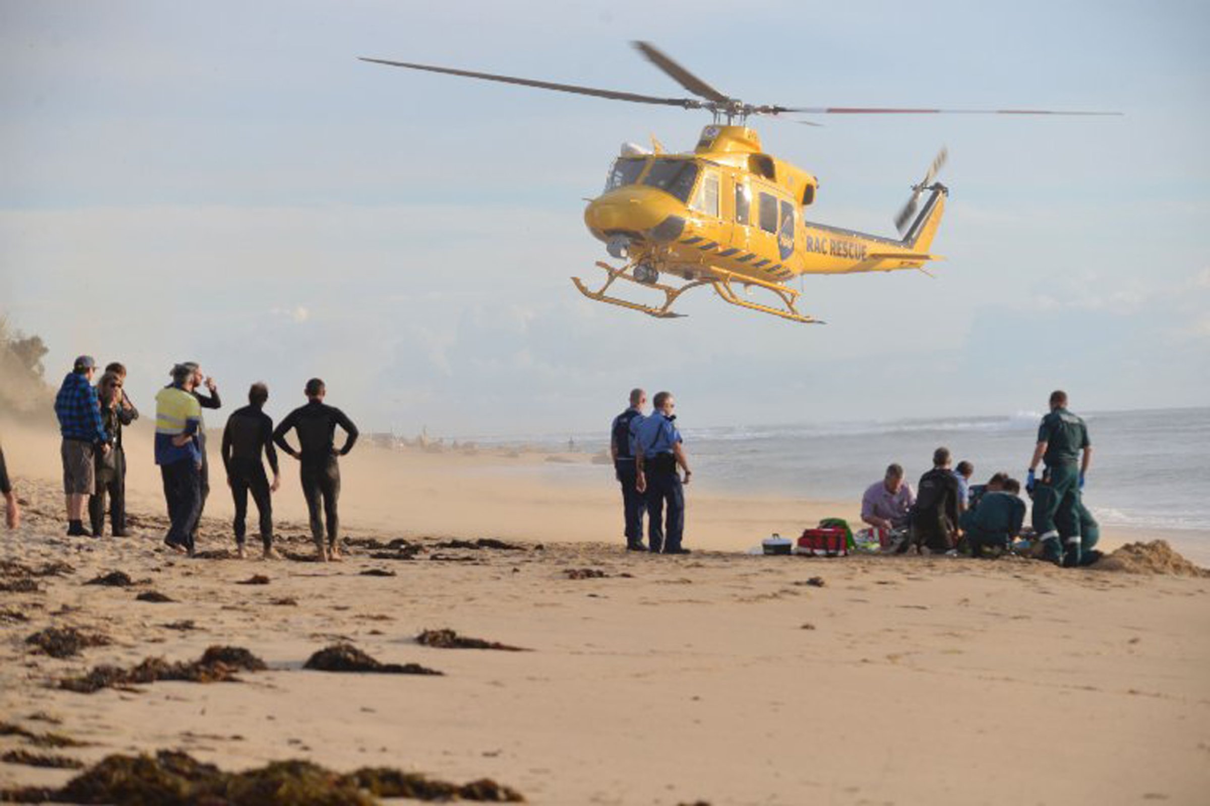 A photo taken on 31 May, 2016, shows a rescue helicopter arriving to transport a critically injured surfer after a shark ripped off his leg in an attack in Australia's west with witnesses recounting how "all hell broke loose" as his board was snapped in half. The attack happened at Falcon Beach, a suburb south of Perth, not long after Surf Life Saving WA, a volunteer non-profit organisation, tweeted that a shark, believed to be a great white, had been sighted in the area. / AFP PHOTO / AFP PHOTO AND MANDURAH MAIL / MARTA PASCUAL JUANOLA / - Australia OUT / ----EDITORS NOTE ----RESTRICTED TO EDITORIAL USE MANDATORY CREDIT " AFP PHOTO / MANDURAH MAIL/MARTA PASCUAL JUANOLA" NO MARKETING NO ADVERTISING CAMPAIGNS - DISTRIBUTED AS A SERVICE TO CLIENTS - NO ARCHIVESMARTA PASCUAL JUANOLA/AFP/Getty Images