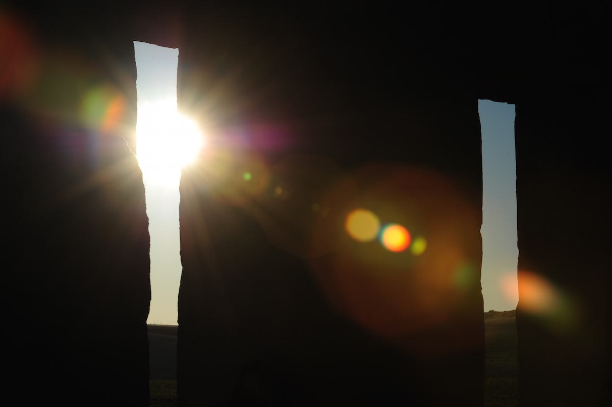 Sunlight penetrates through a full-size replica of Stonehenge in Maryhill, Wash. on the summer solstice, June 21, 2014. (Alex Milan Tracy—Sipa USA/AP)
